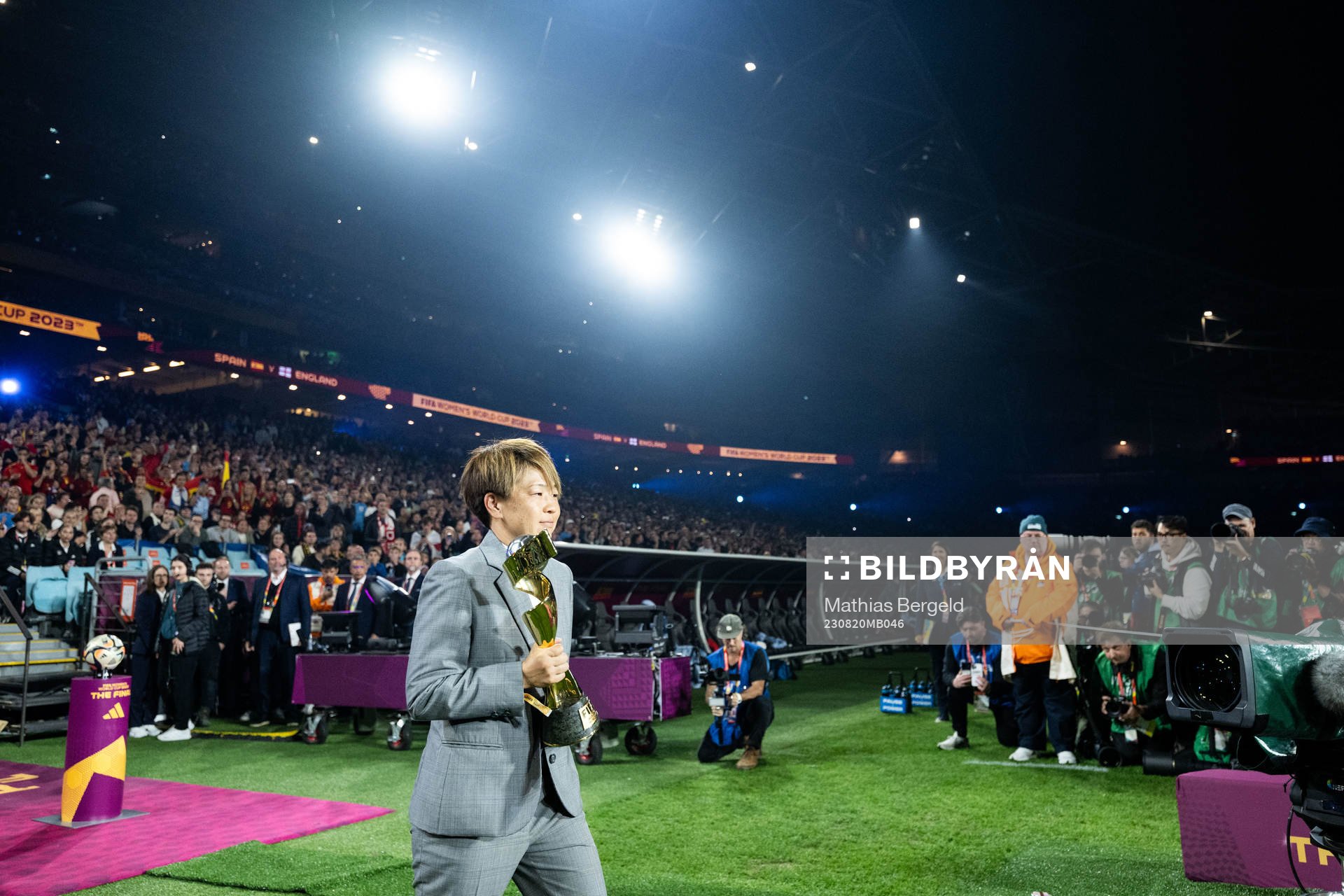 Aya Miyama and the World Cup trophy