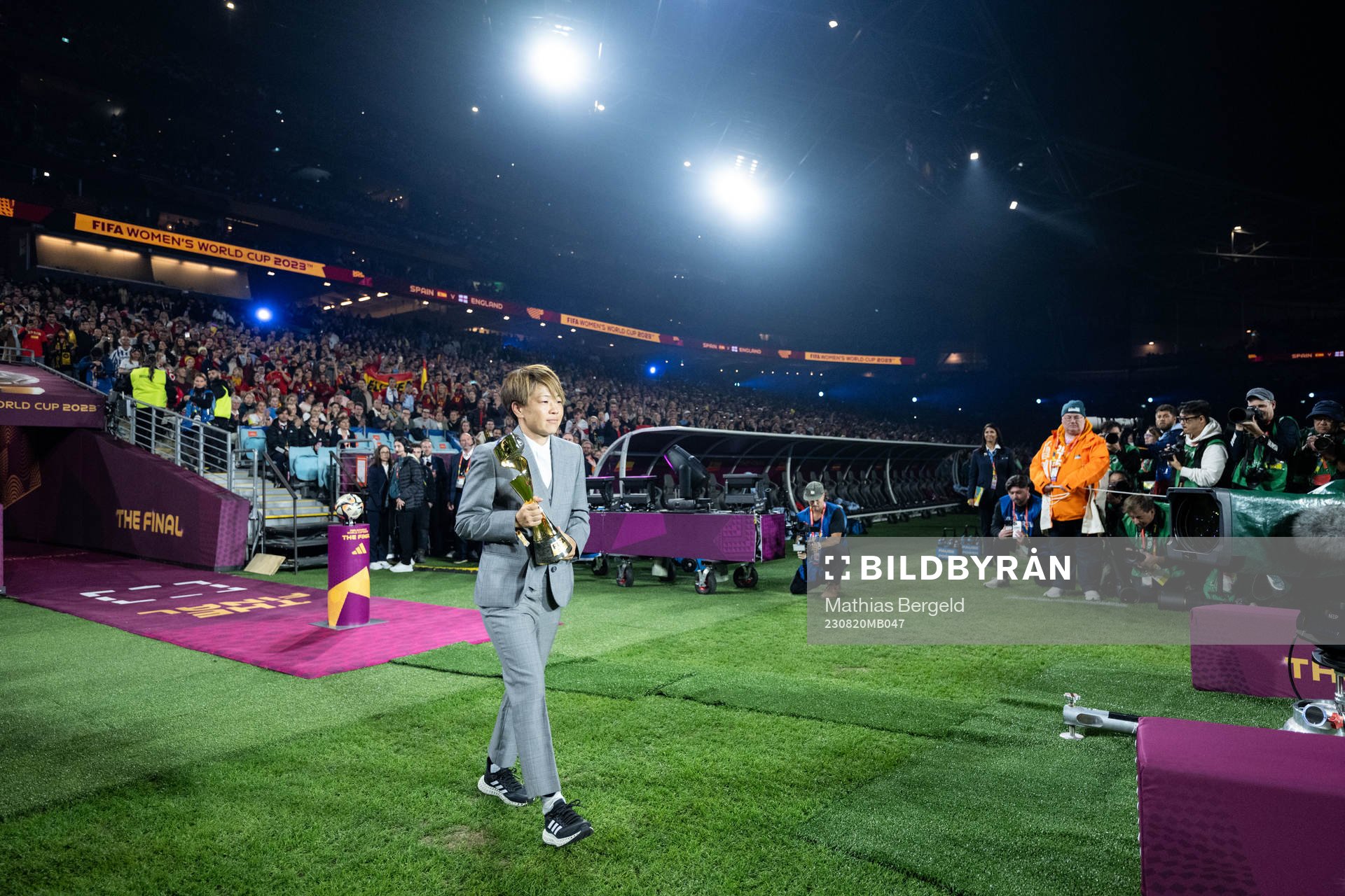 Aya Miyama and the World Cup trophy