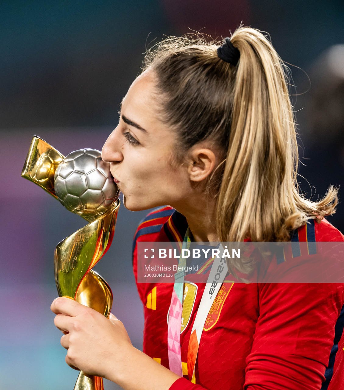 Olga Carmona of Spain celebrates with the trophy