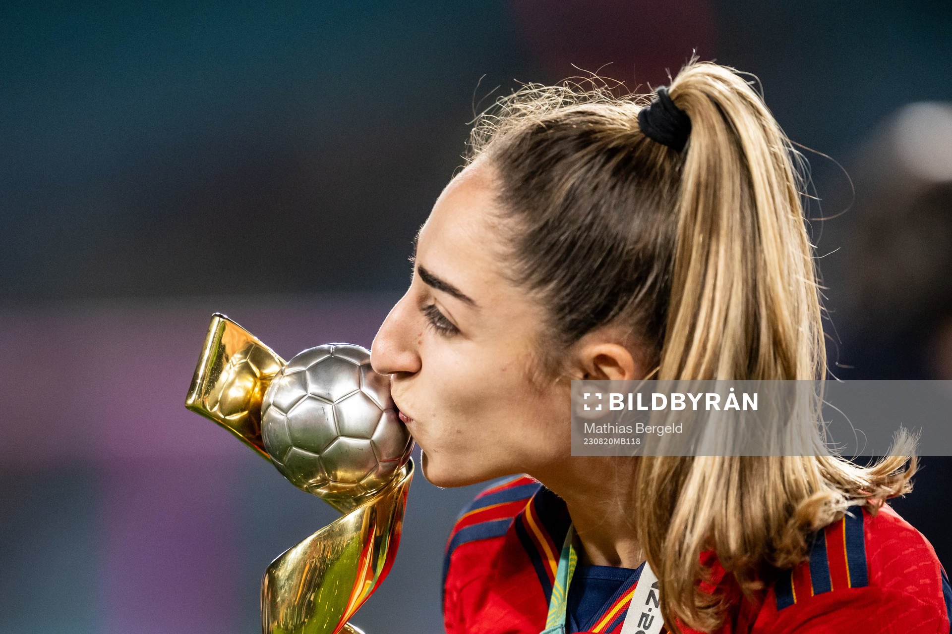 Olga Carmona of Spain celebrates with the trophy