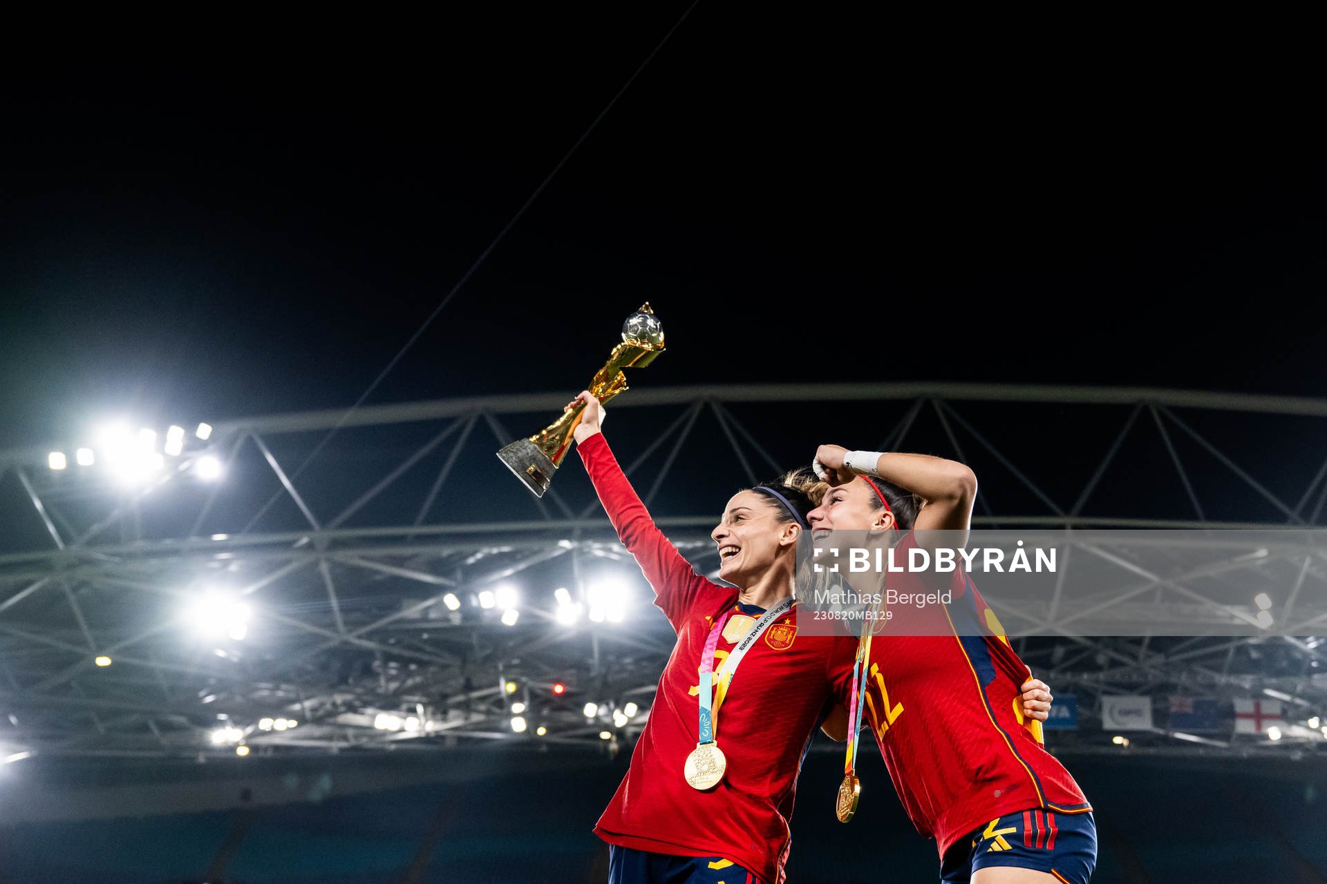 Esther Gonzalez and Athenea del Castillo of Spain celebrate with the trophy after the FIFA Women's World Cup final between Spain and England on August 20, 2023 in Sydney.