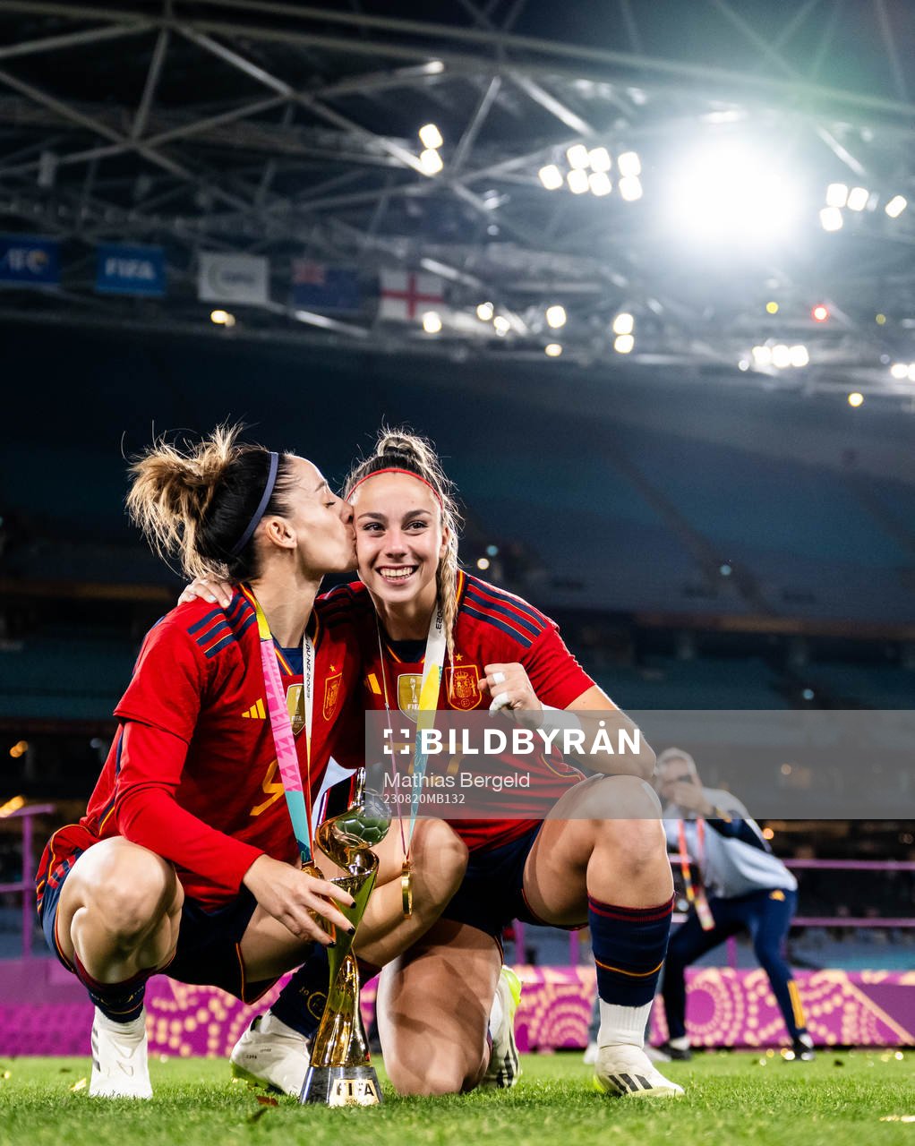 Esther Gonzalez and Athenea del Castillo of Spain celebrate with the trophy after the FIFA Women's World Cup final between Spain and England on August 20, 2023 in Sydney.