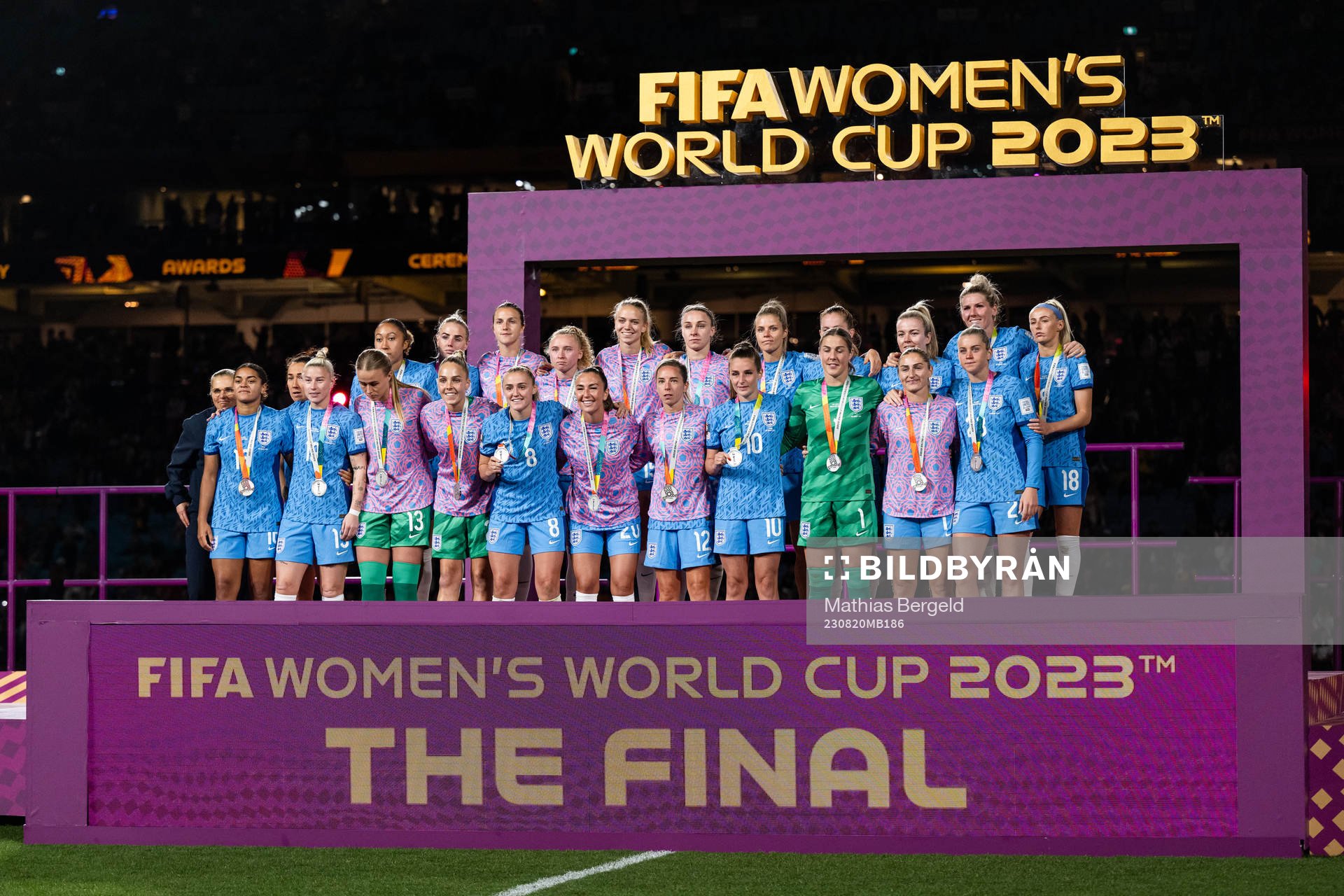 Players of England pose for a photo at the medal ceremony