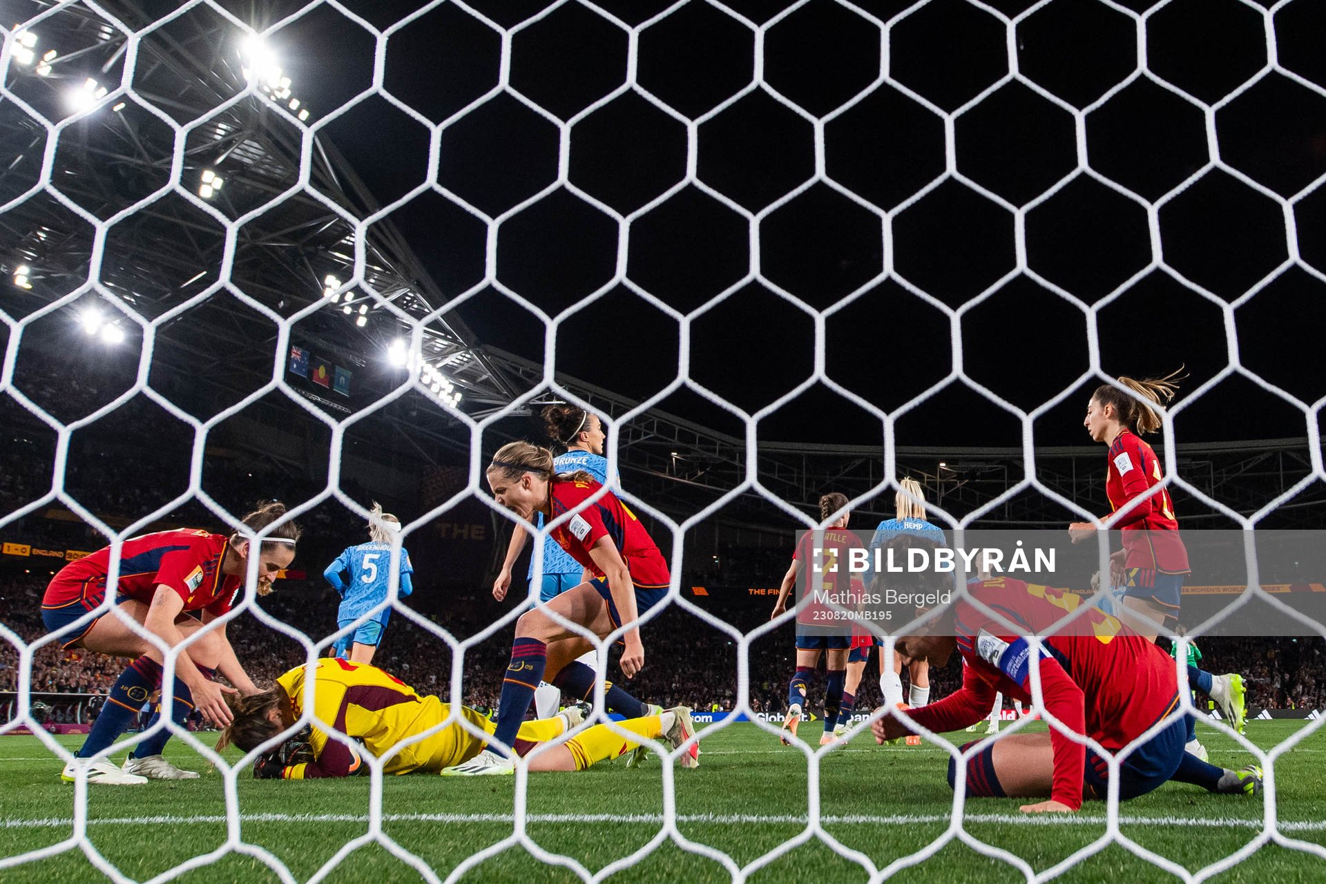 Goalkeeper Cata Coll, Ivana Andres and Irene Paredes celebrate after a save during the FIFA Women's World Cup final between Spain and England on August 20, 2023 in Sydney.