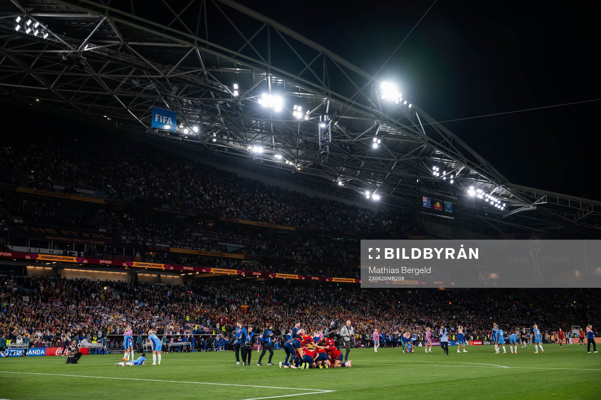 Players of England look dejected while players of Spain