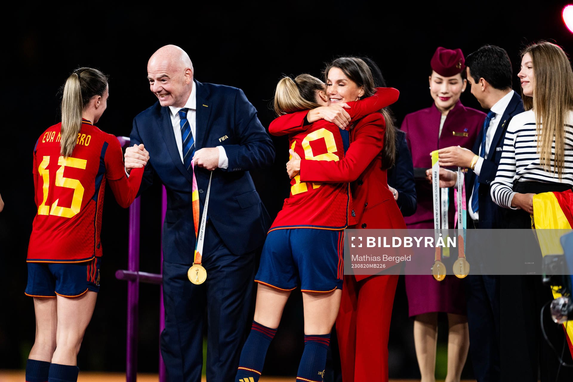 Eva Navarro of Spain receives the medal from FIFA president Gianni Infantino while Salma Paralluelo hugs Queen Letizia of Spain at the medal ceremony after the FIFA Women's World Cup final between Spain and England on August 20, 2023 in Sydney.