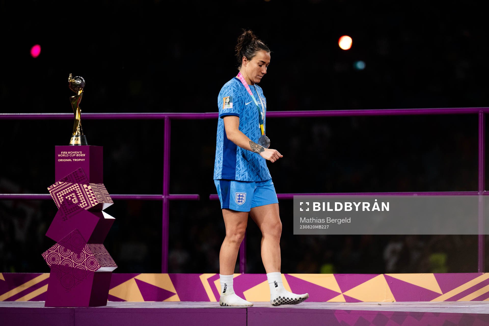 Lucy Bronze of England looks dejected as she walks past the