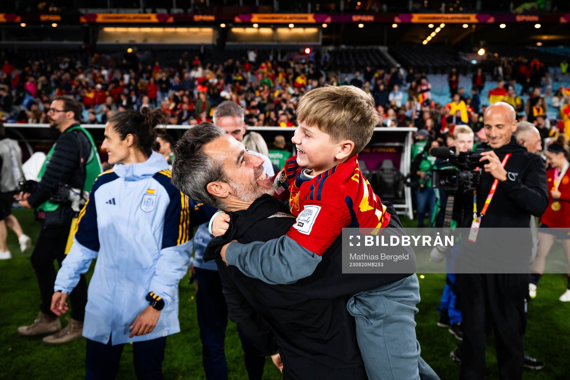 Head coach Jorge Vilda of Spain celebrates with a child after the FIFA Women's World Cup final between Spain and England on August 20, 2023 in Sydney.