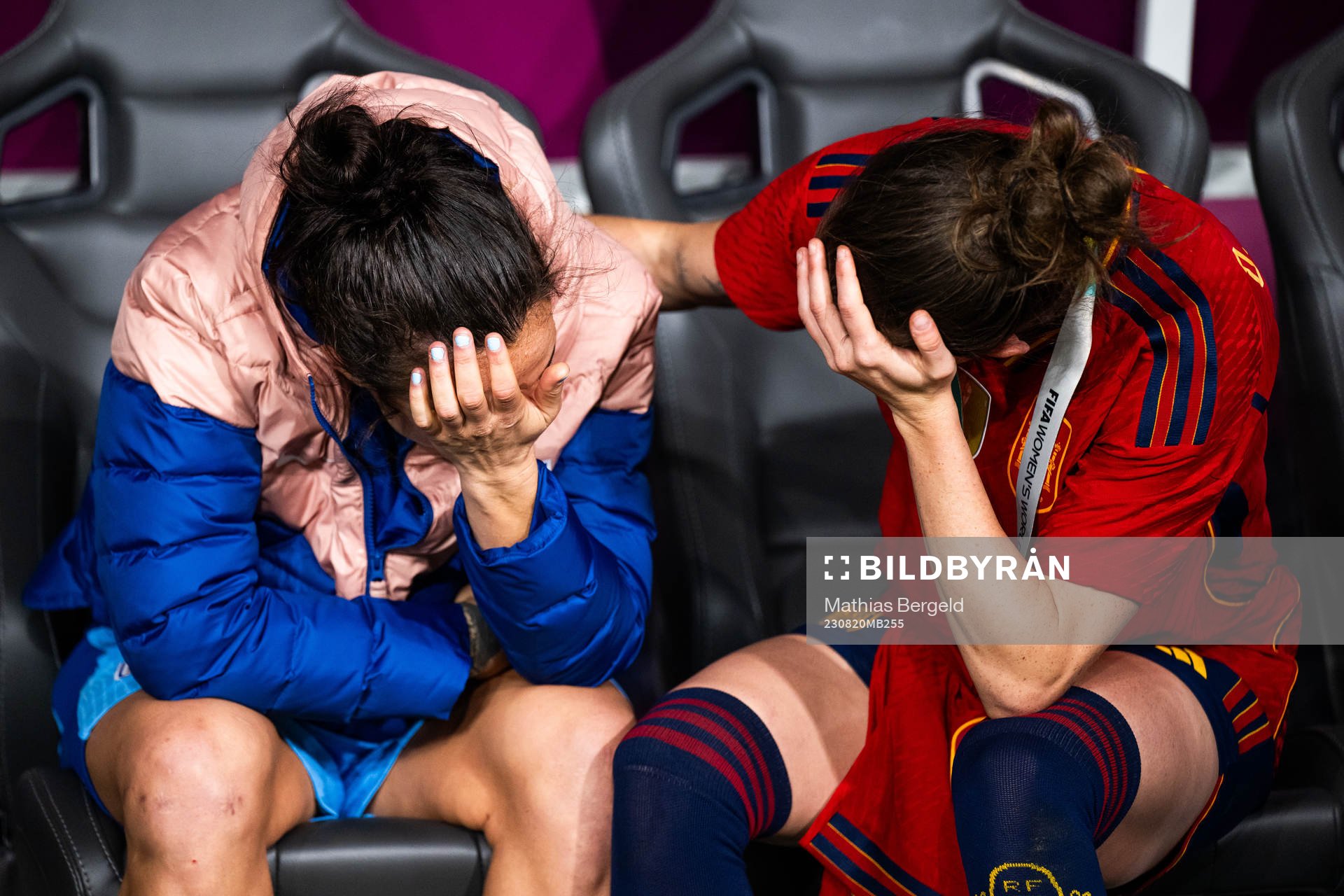 Lucy Bronze of England looks dejected and is consoled by