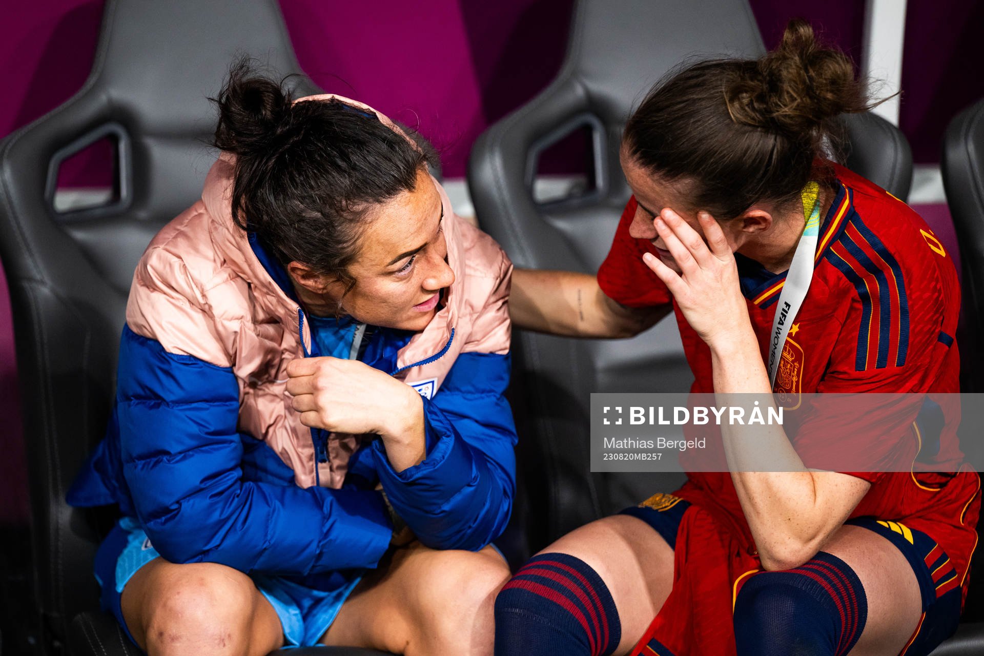 Lucy Bronze of England looks dejected and is consoled by