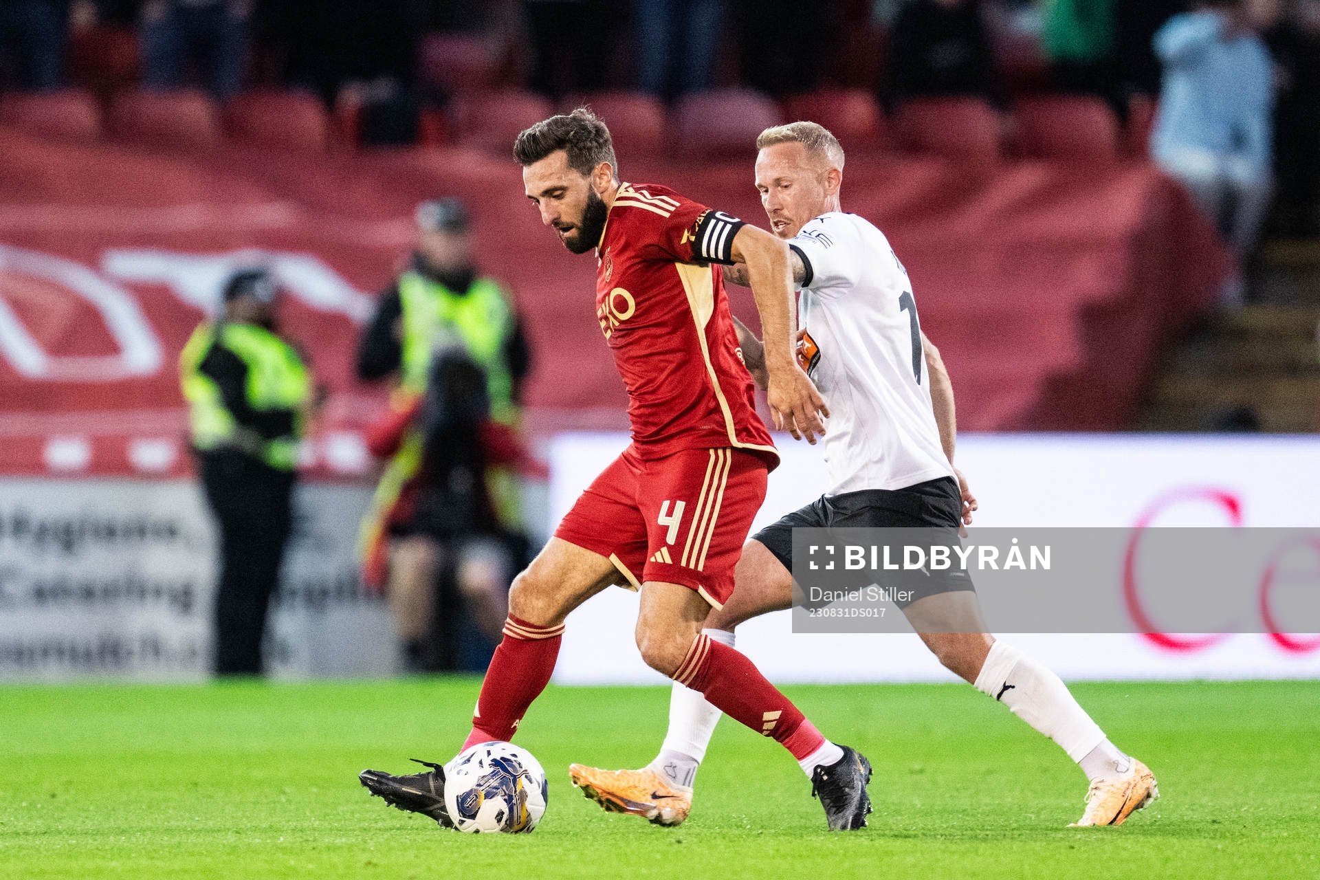 Graeme Shinnie of Aberdeen and Mikkel Rygaard Jensen of