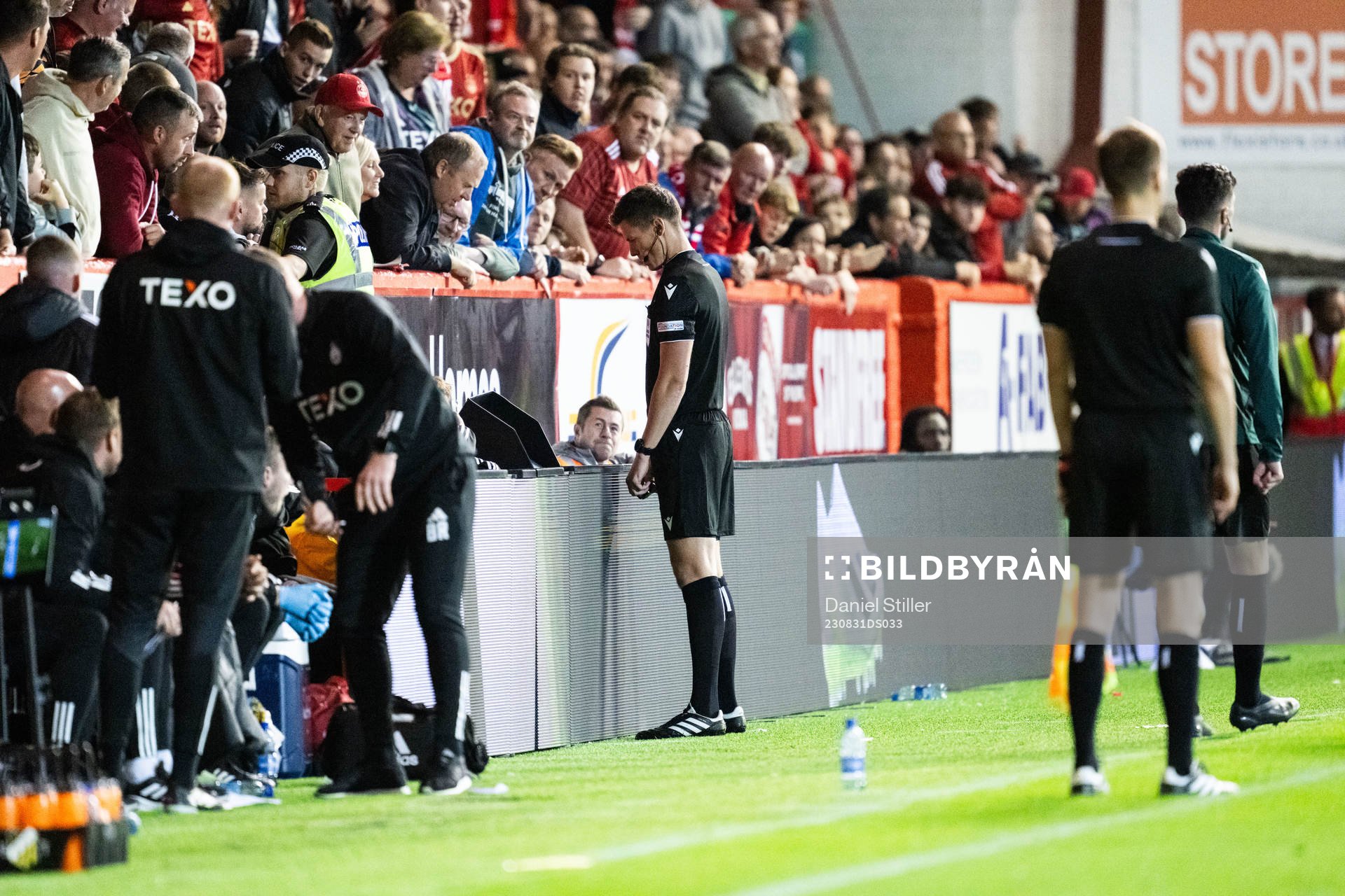 Referee Daniel Siebert watches the VAR screen