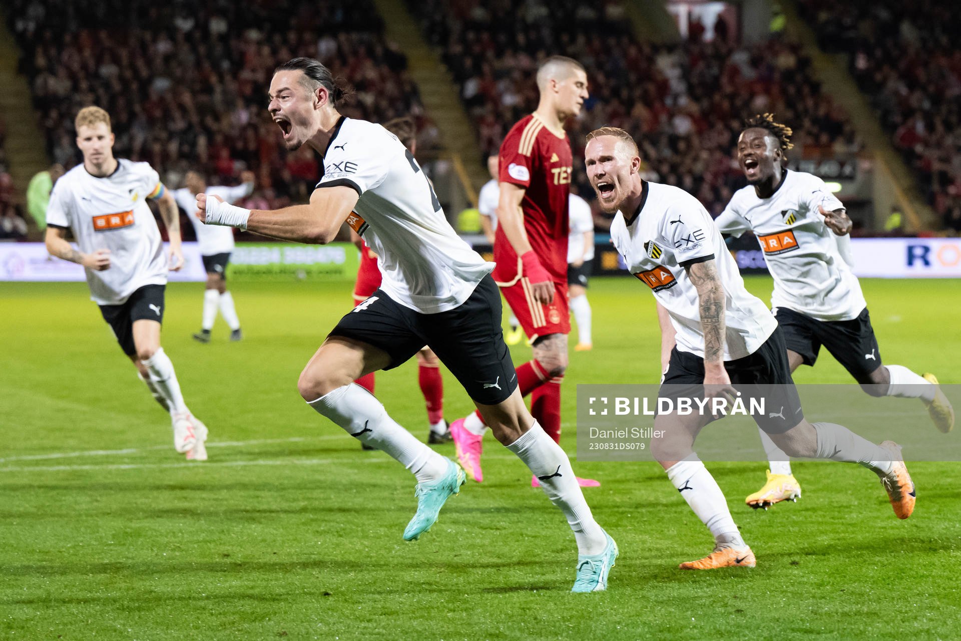 Amor Layouni of Häcken celebrates together with Mikkel Rygaard Jensen and Ibrahim Sadiq arter scoring 1-3 during the UEFA Europa League play-off between Aberdeen and Häcken on August 31, 2023 in Aberdeen.