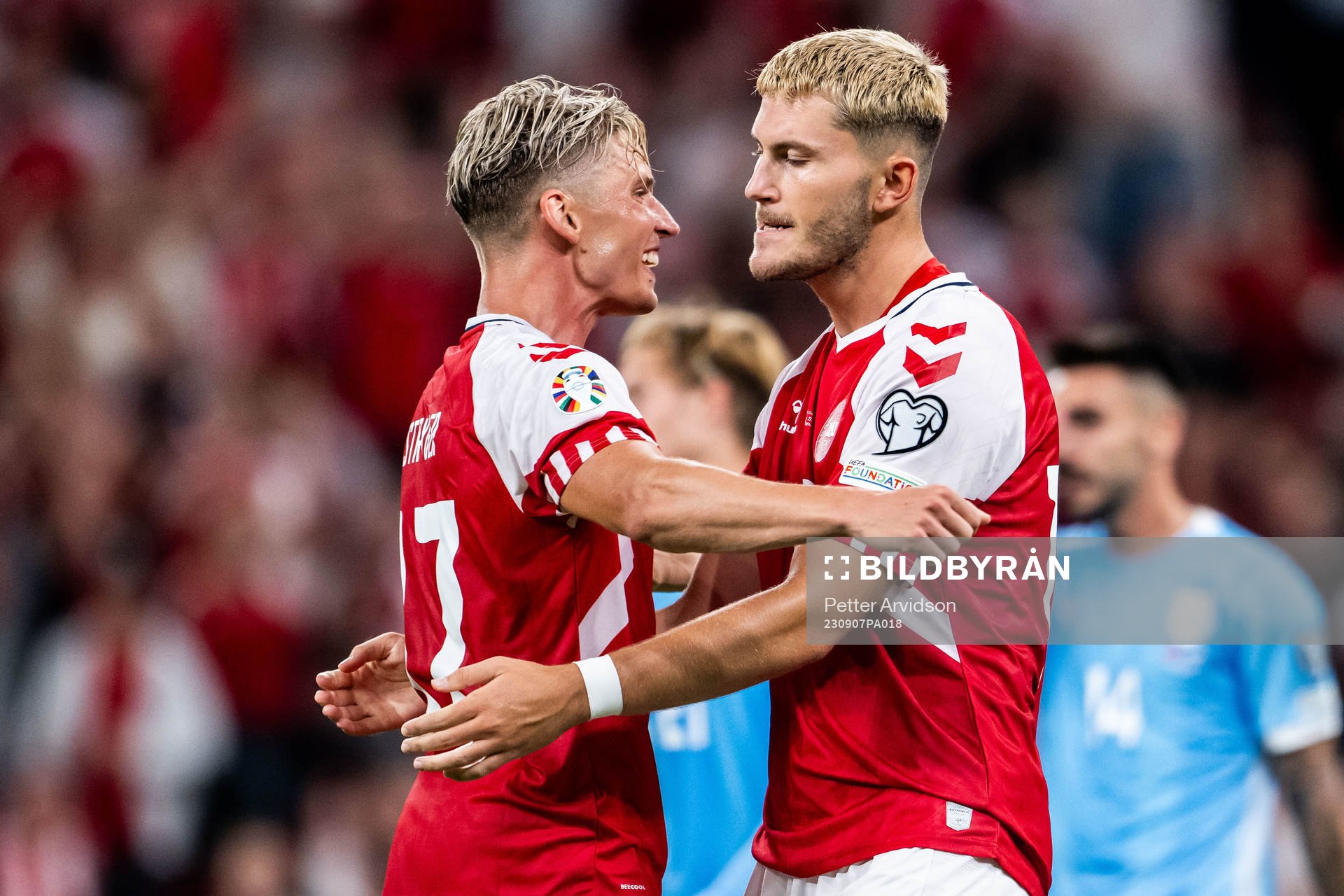 Jonas Wind of Denmark celebrates with Jens Stryger