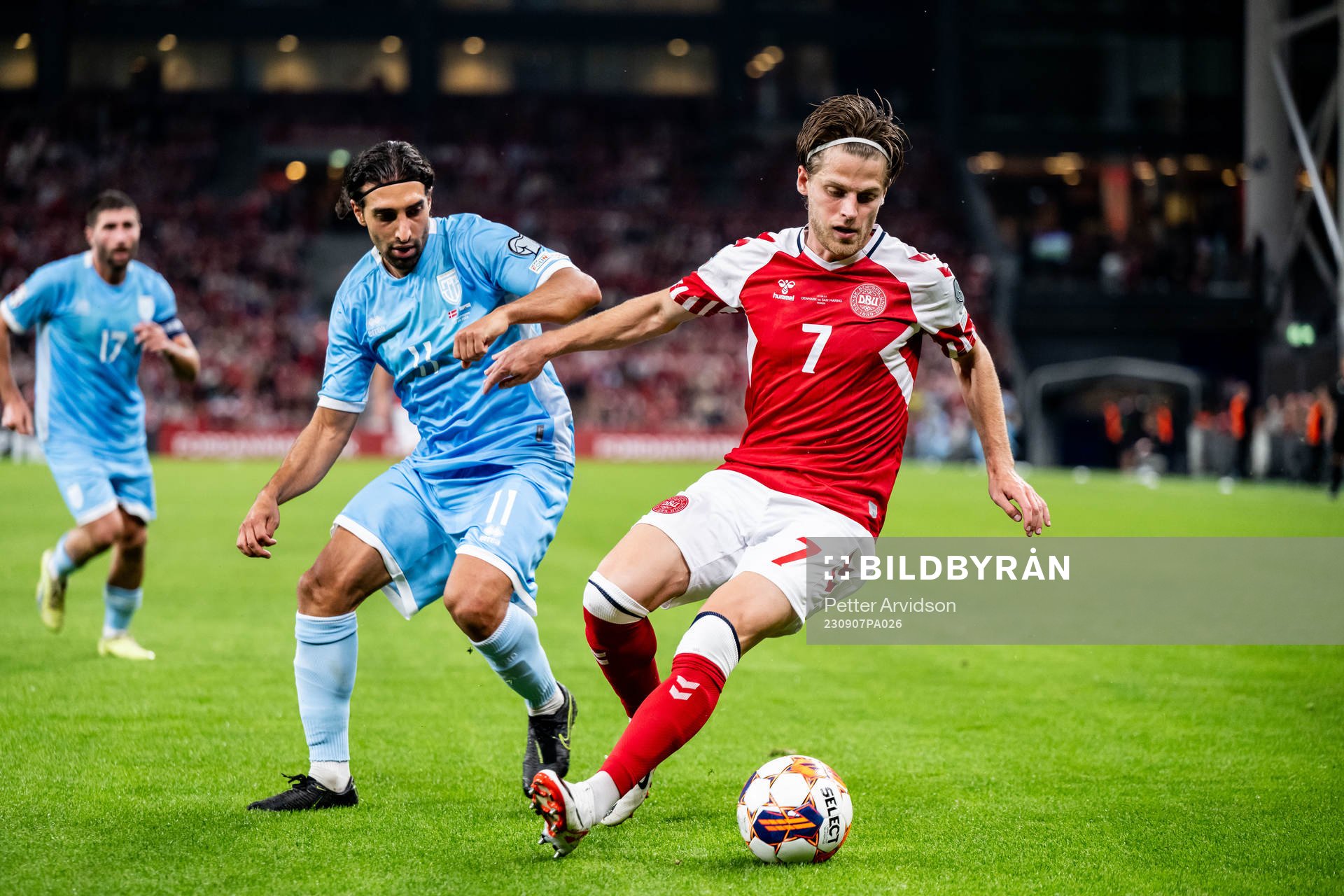 Manuel Battistini of San Marino and Mathias Jensen of