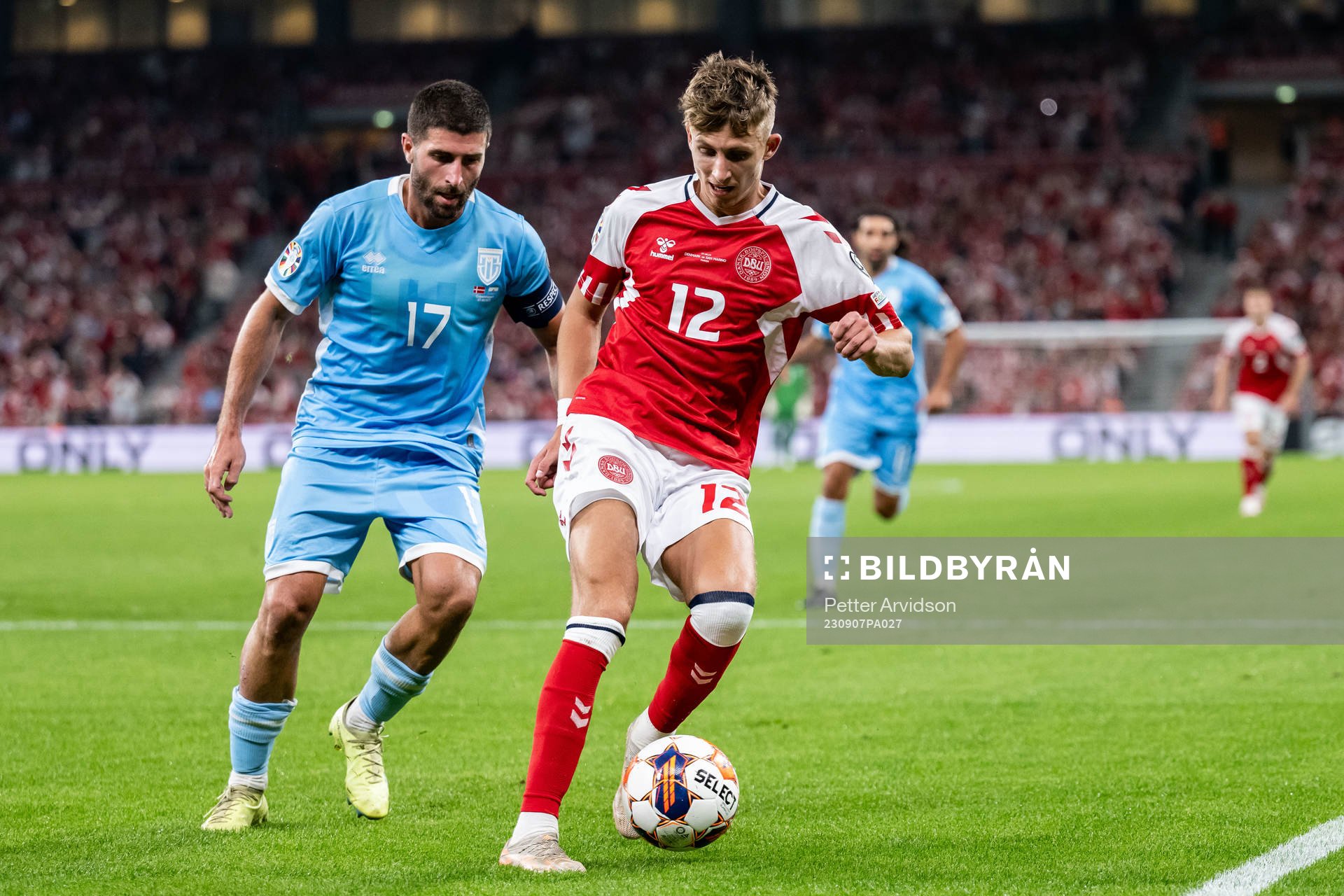 Alessandro Golinucci of San Marino and Jesper Lindstrøm of