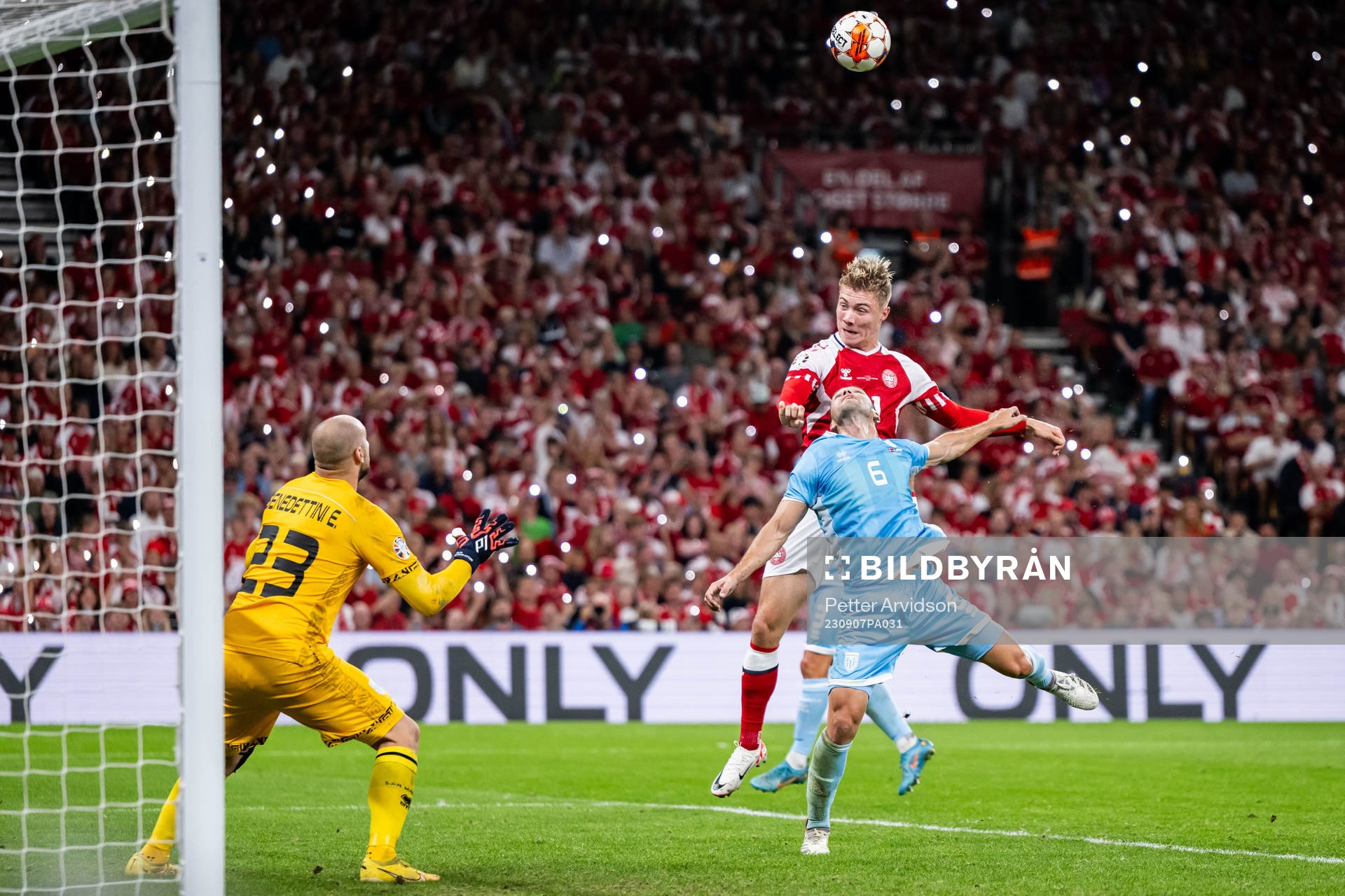 Rasmus Højlund of Denmark against goalkeeper Elia