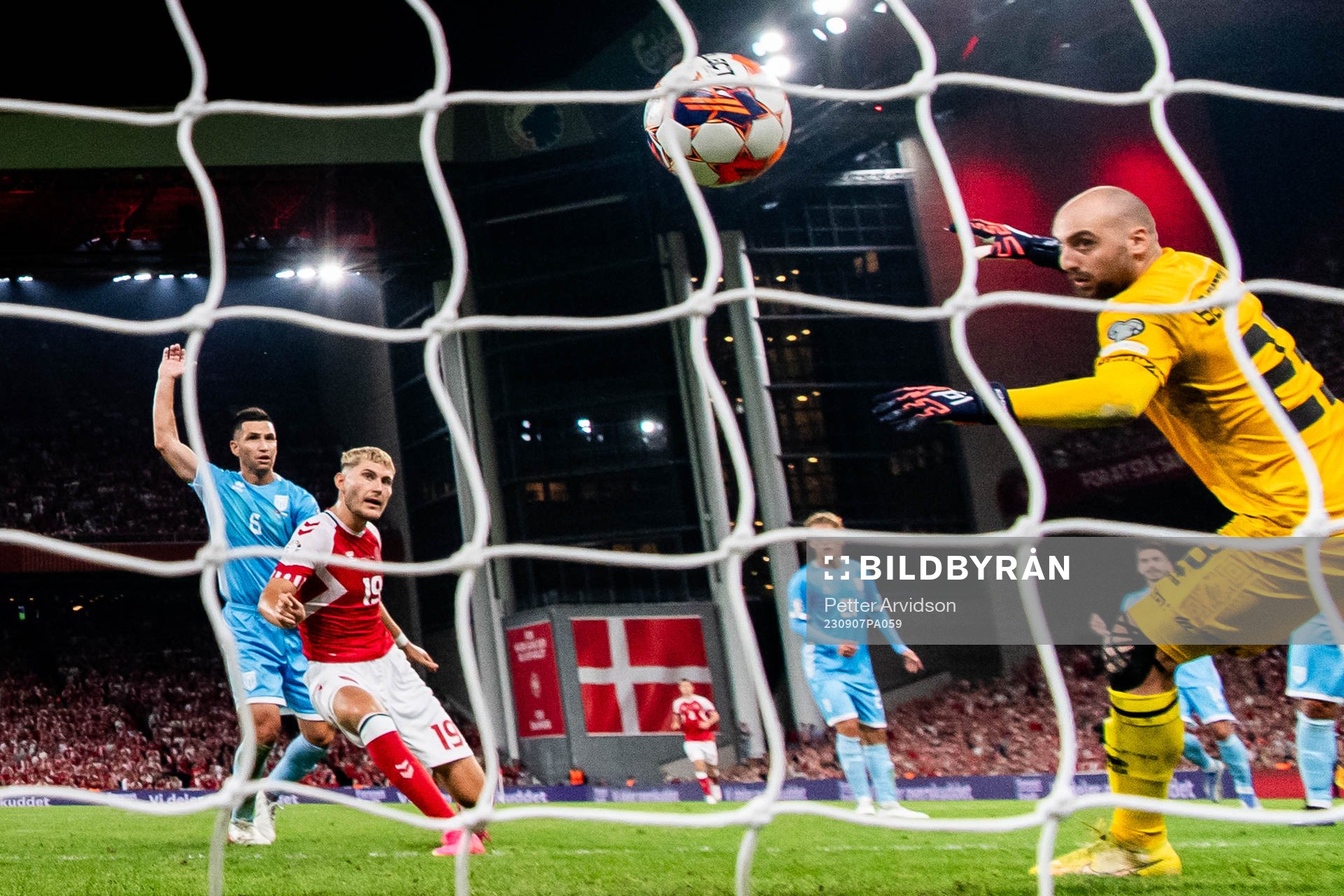 Jonas Wind of Denmark scores the 3-0 goal against