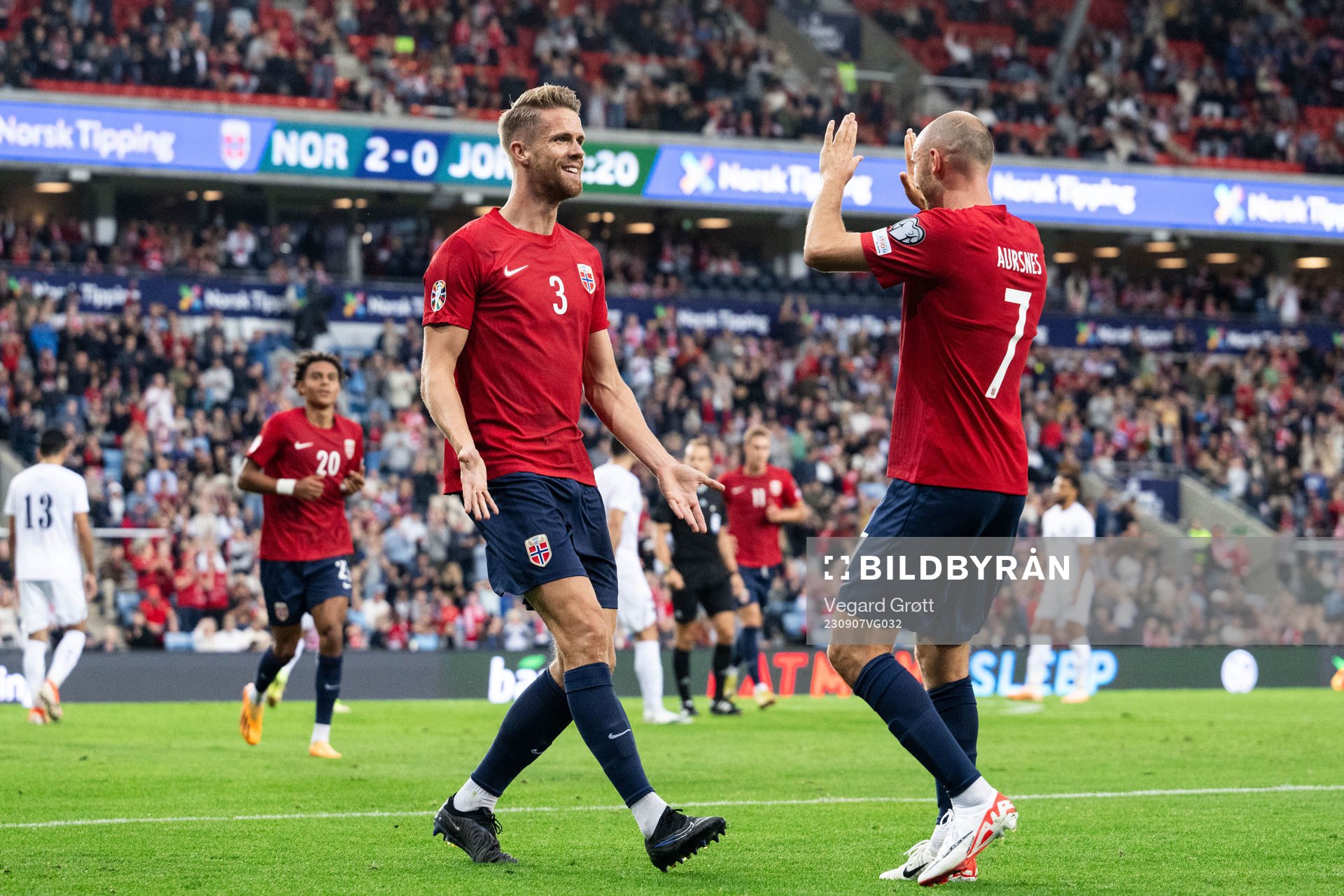 Kristoffer Ajer celebrates with Fredrik Aursnes of Norway