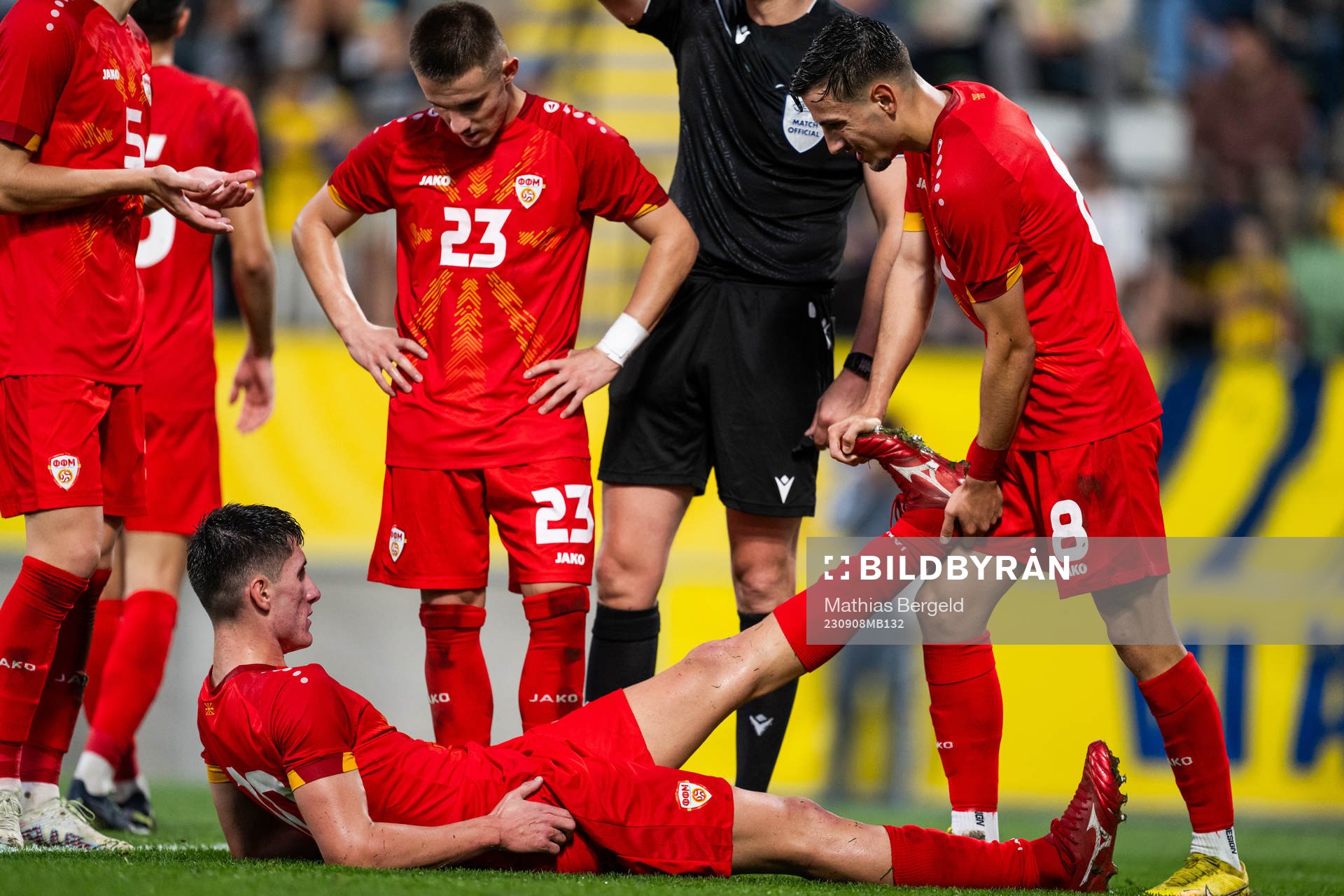 Luka Stankovski gets his leg stretched by Ivan Nikolov of