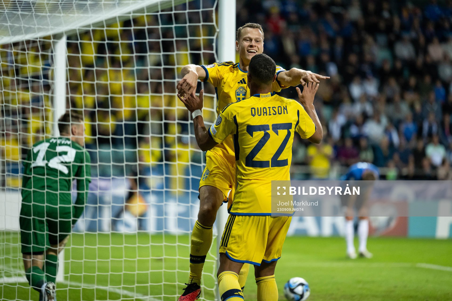 Viktor Claesson and Robin Quaison of Sweden celebrate