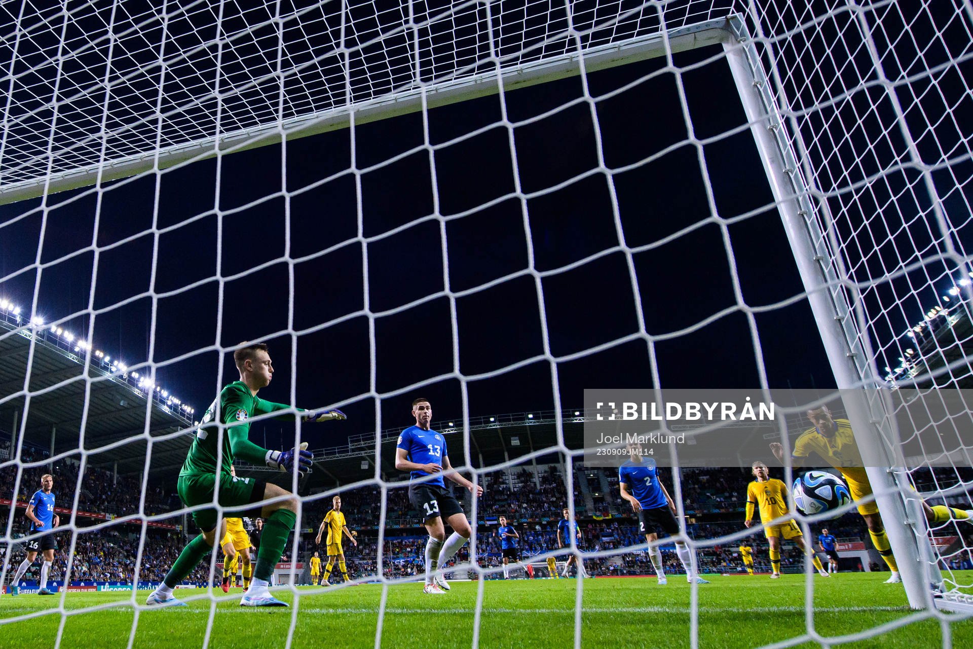 Robin Quaison of Sweden scores 0-4 behind goalkeeper Karl