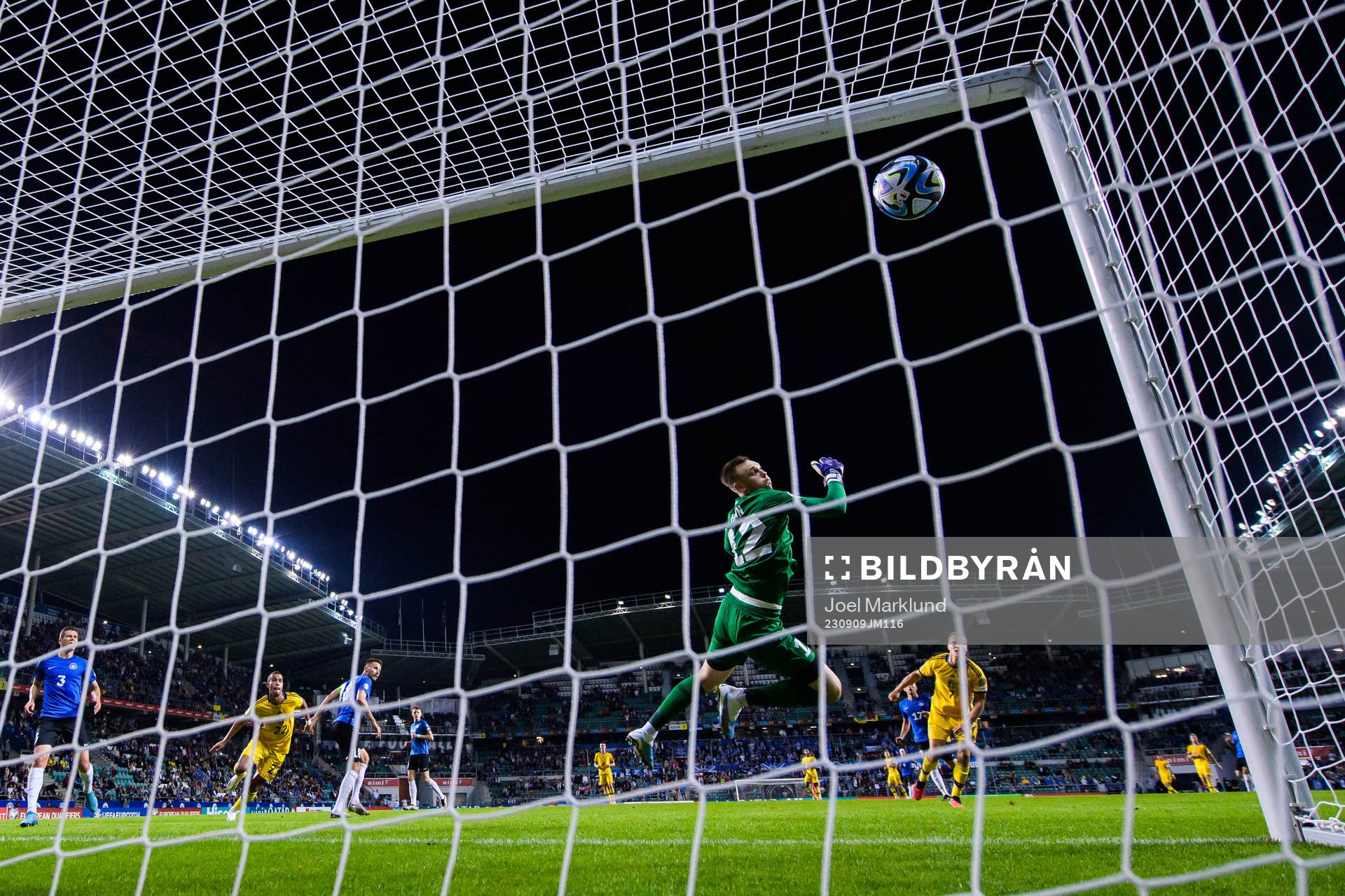 Viktor Claesson of Sweden scores 0-5 behind goalkeeper Karl