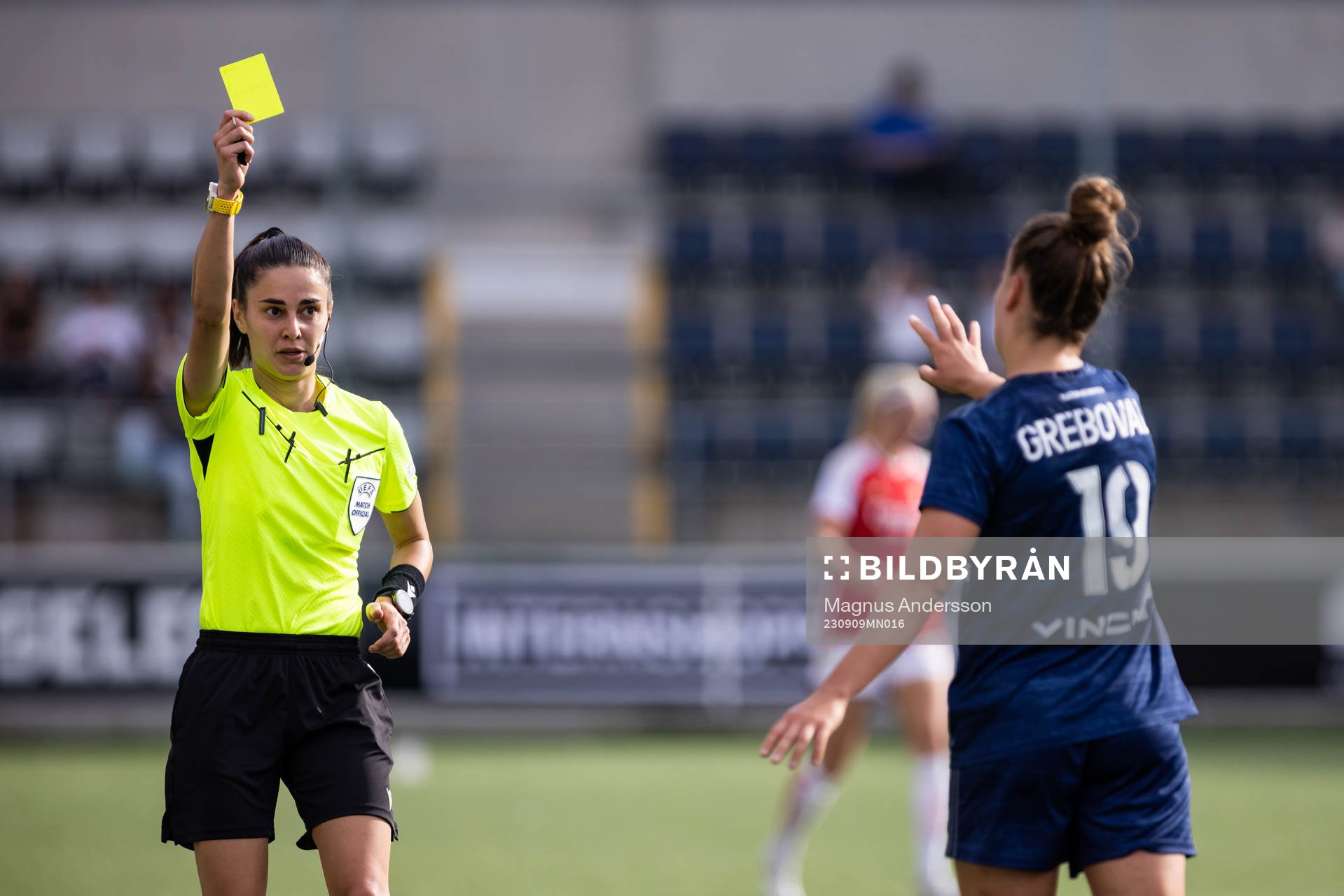 Théa Greboval of Paris FC is shown a yellow card by the