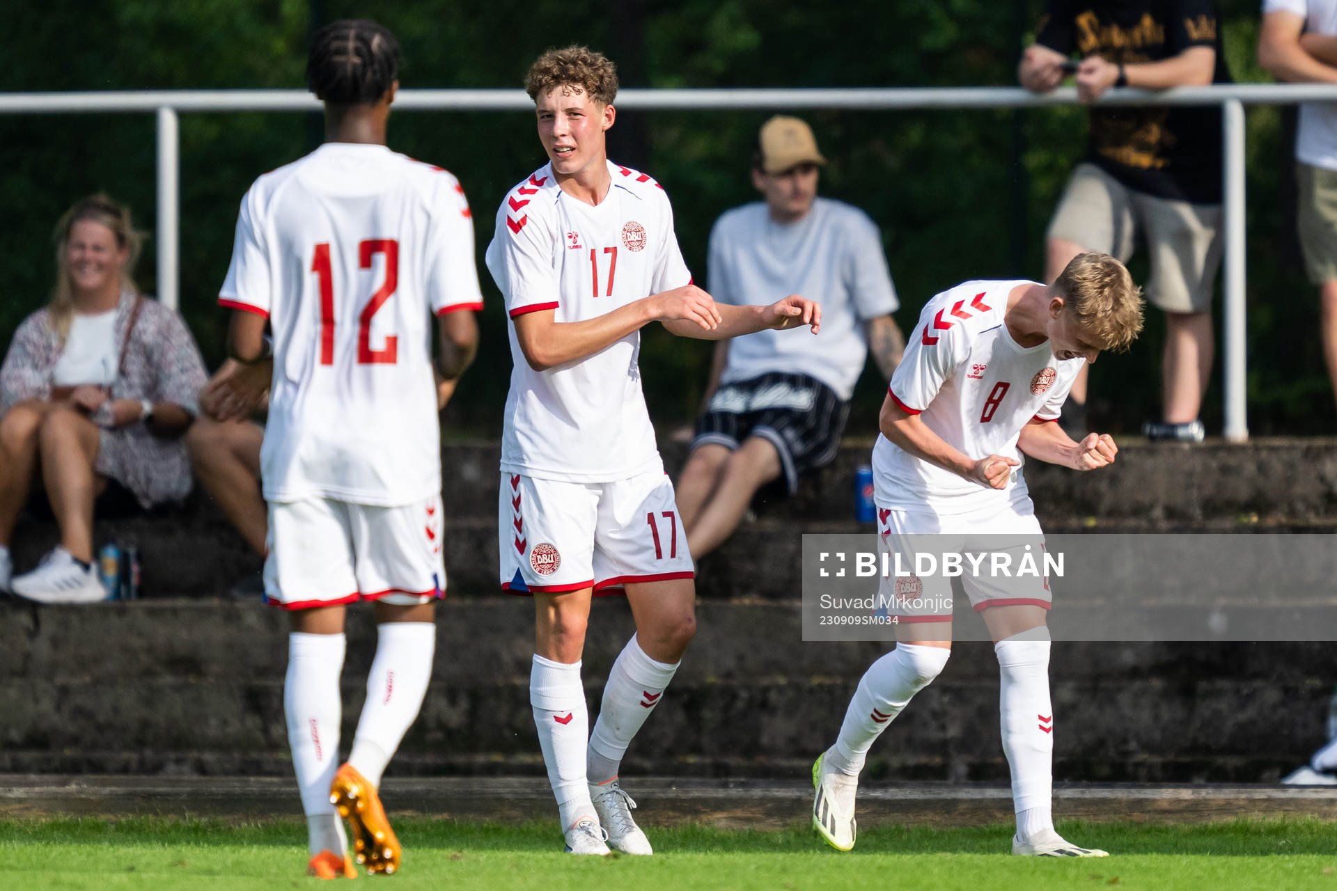 Tobias Lund of Denmark celebrate with teammates