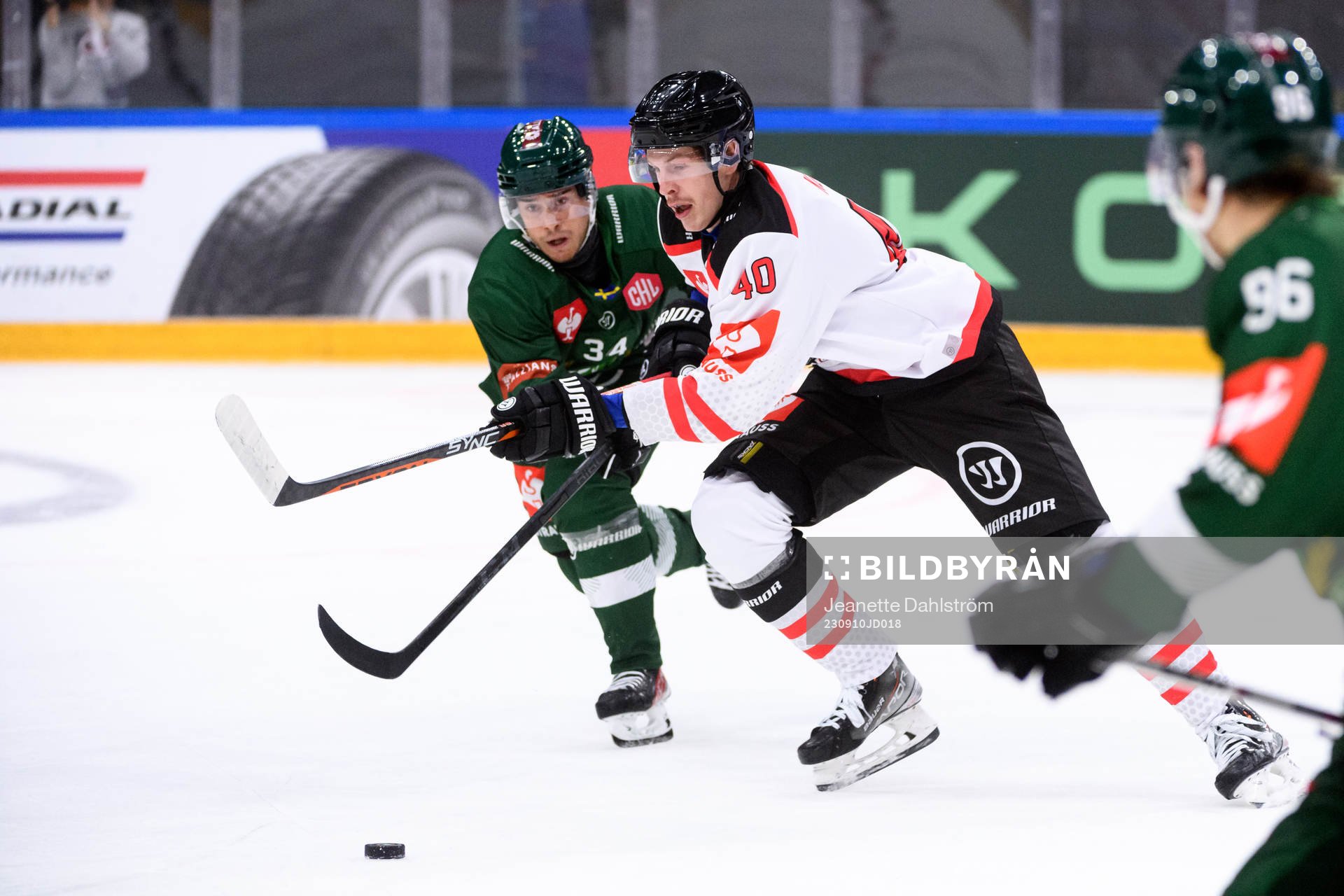 Michael Lindqvist of Färjestad and Anders Koch of Aalborg