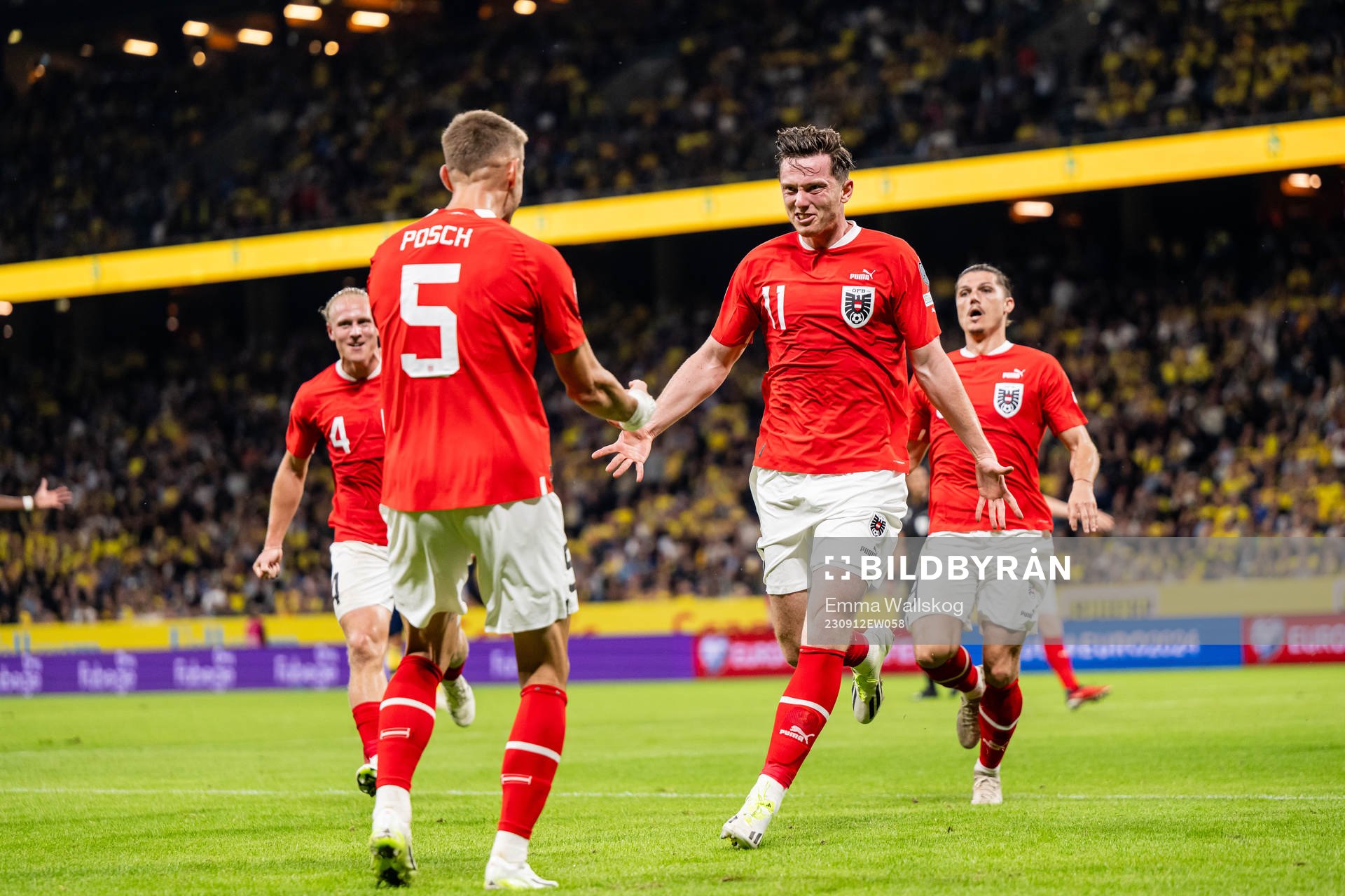 Michael Gregoritsch and Stefan Posch of Austria celebrate