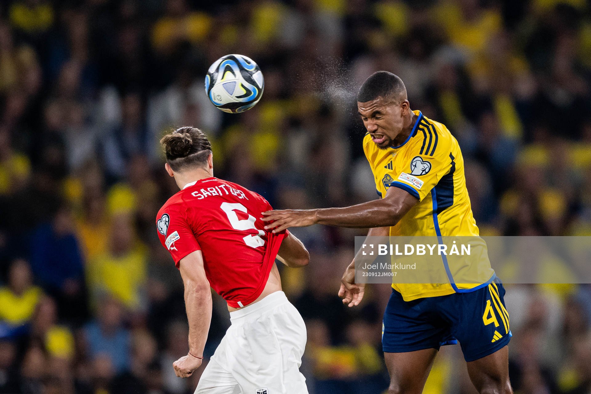 Marcel Sabitzer of Austria and Isak Hien of Sweden