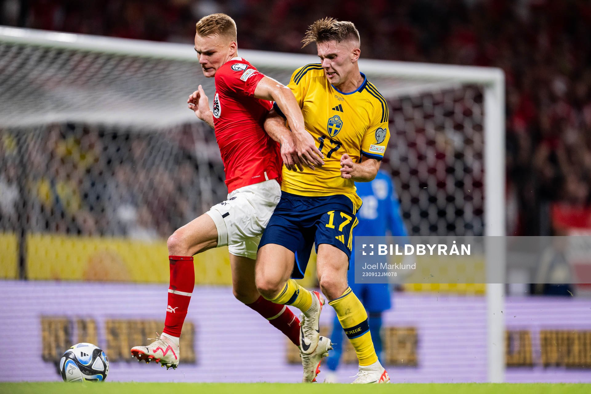 Stefan Posch of Austria and Viktor Gyökeres of Sweden
