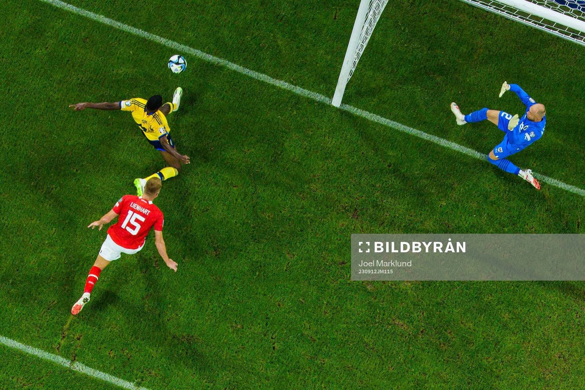 Alexander Isak of Sweden challenges Philipp Lienhart and