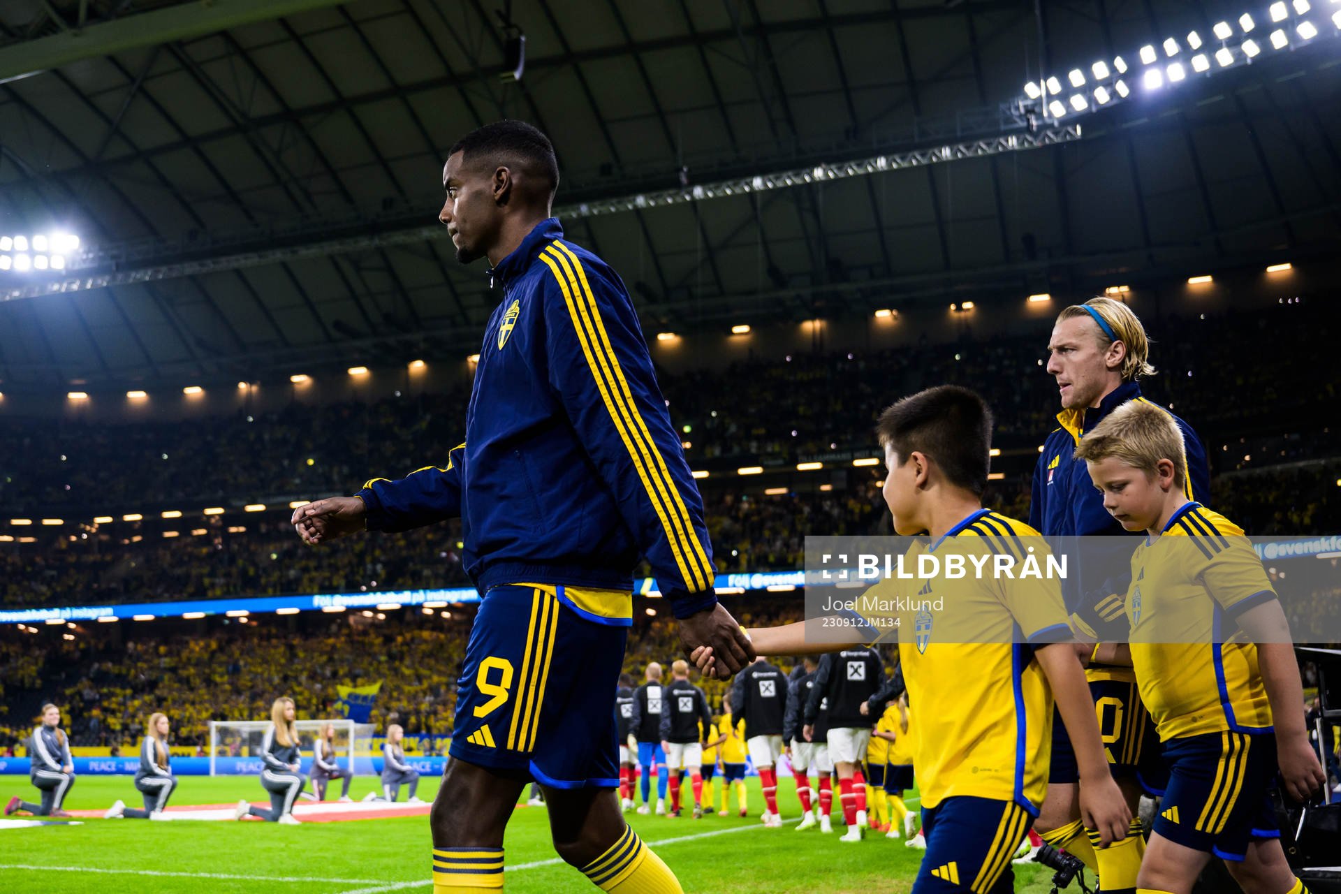 Alexander Isak and Emil Forsberg of Sweden enter the pitch