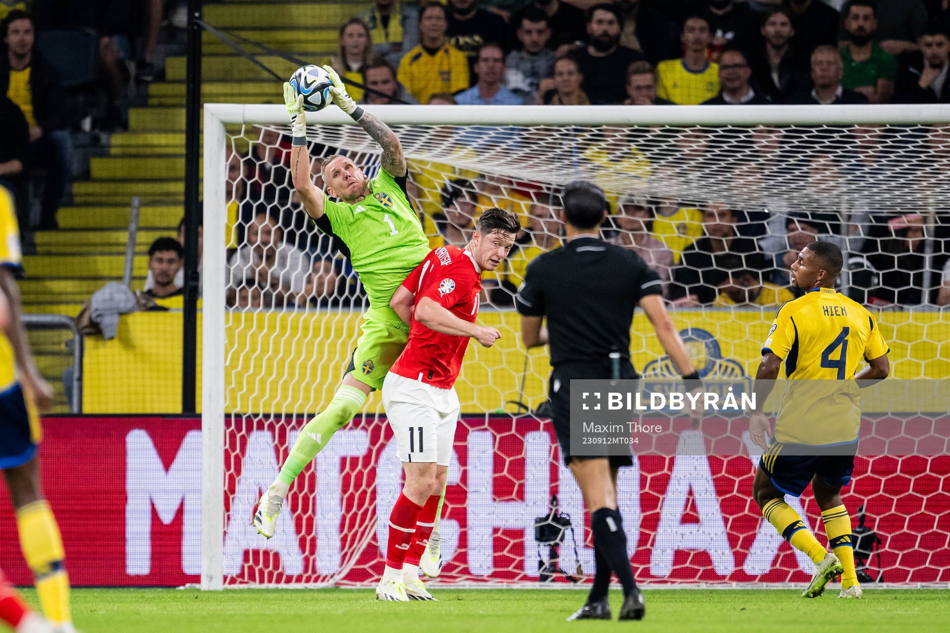 Goalkeeper Robin Olsen of Sweden and Michael Gregoritsch of