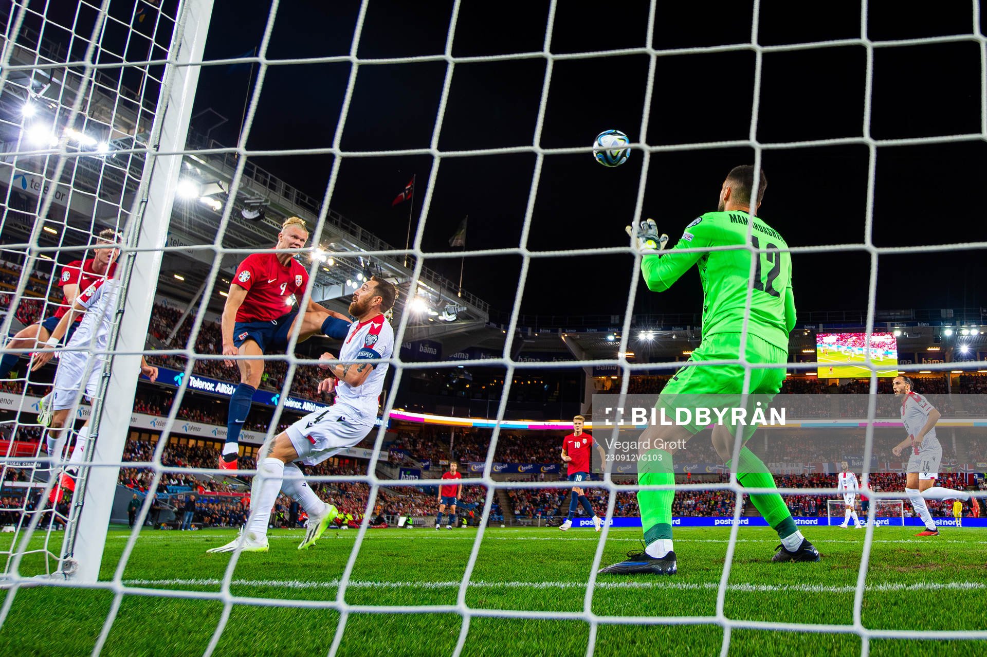 Erling Braut Haaland of Norway scores 1-0 behind goalkeeper