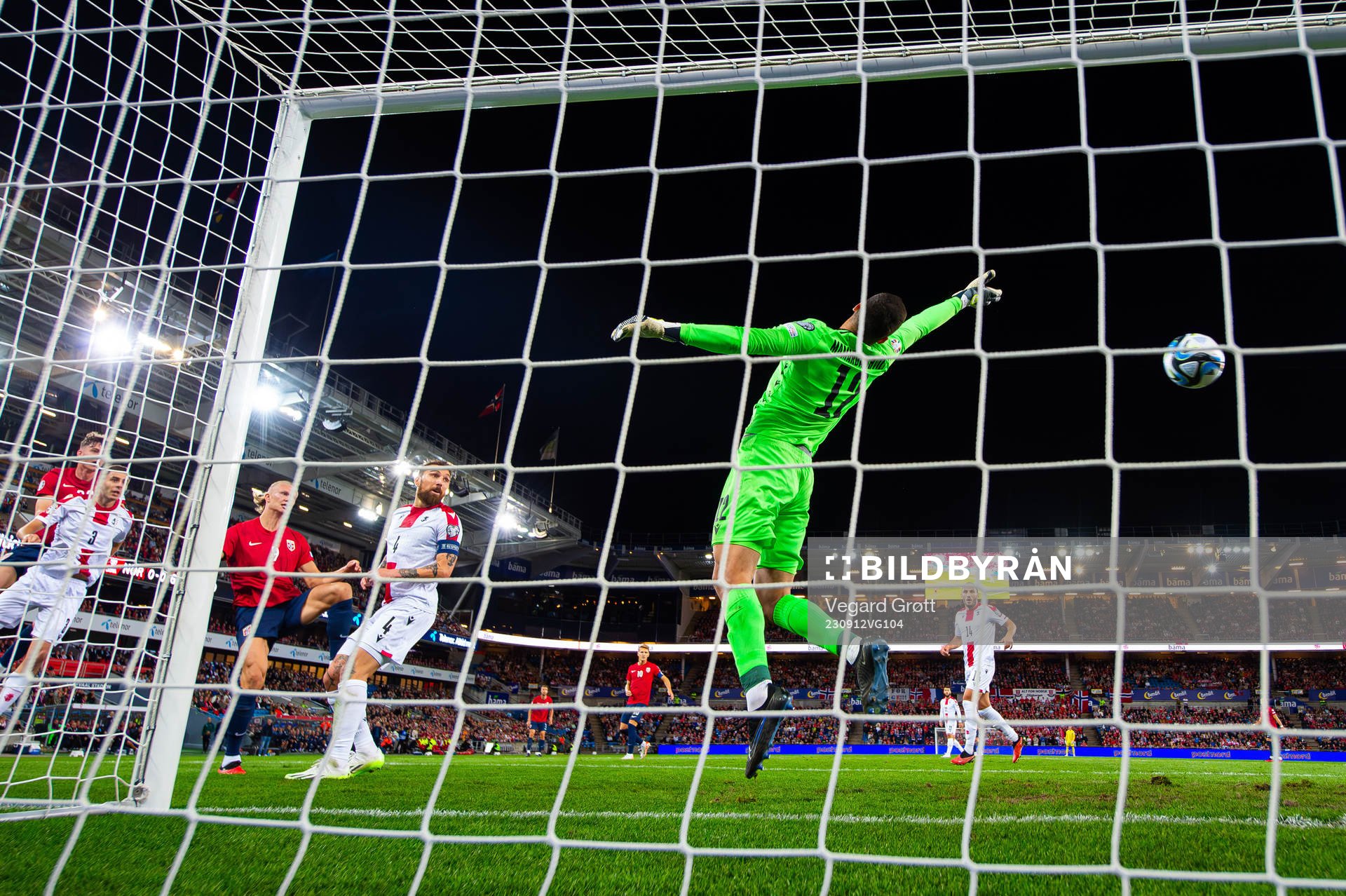 Erling Braut Haaland of Norway scores 1-0 behind goalkeeper