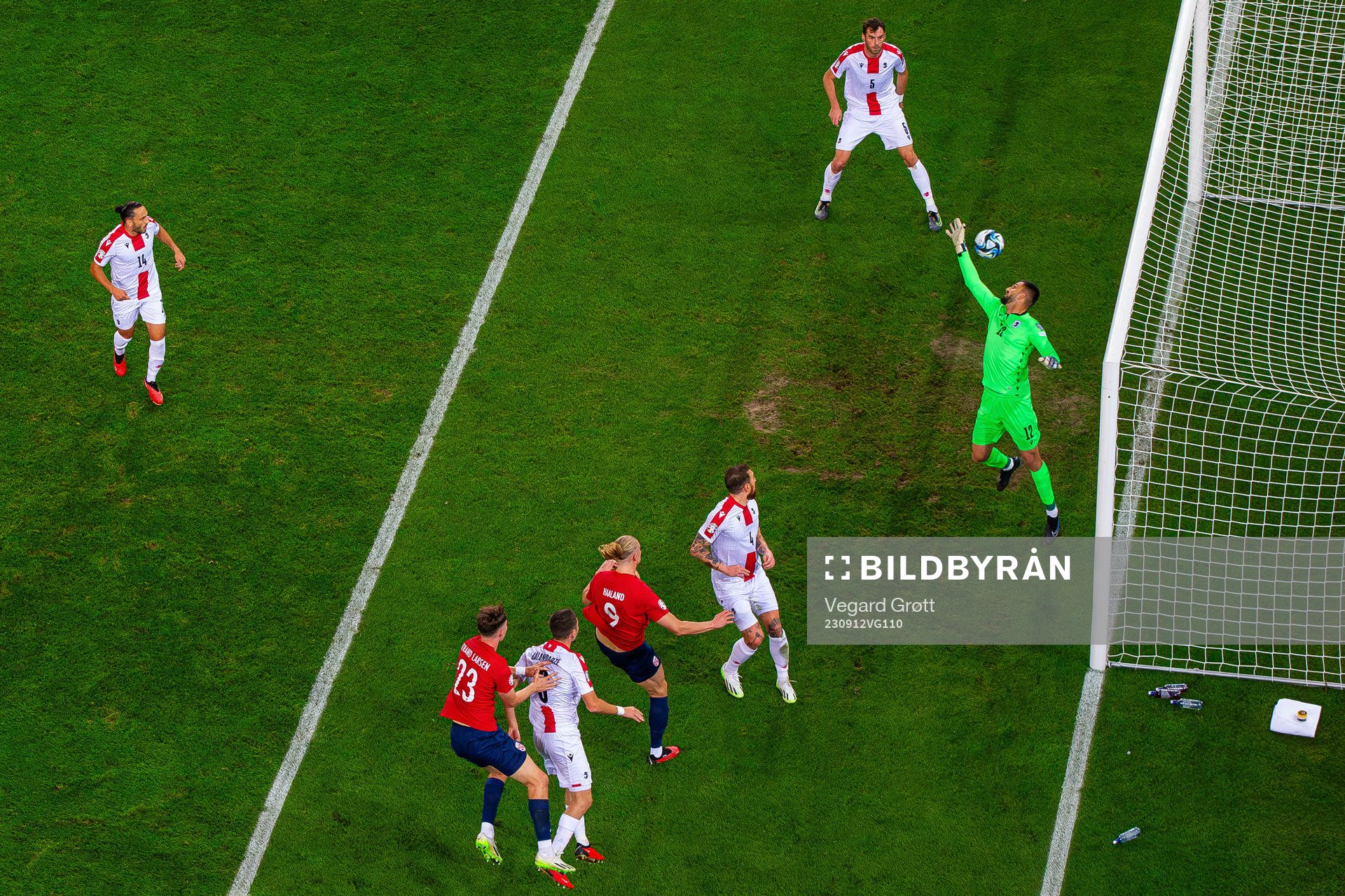 Erling Braut Haaland of Norway scores 1-0 behind goalkeeper