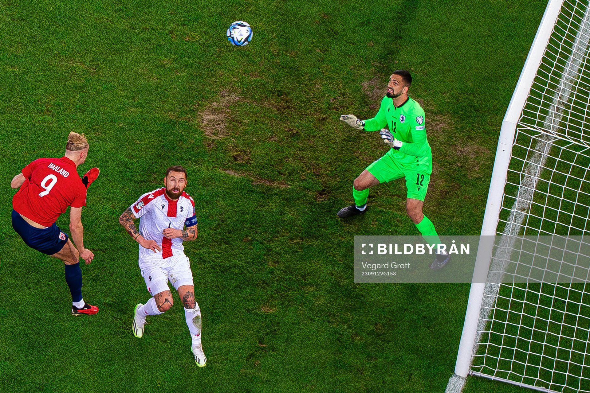 Erling Braut Haaland of Norway scores 1-0 behind goalkeeper