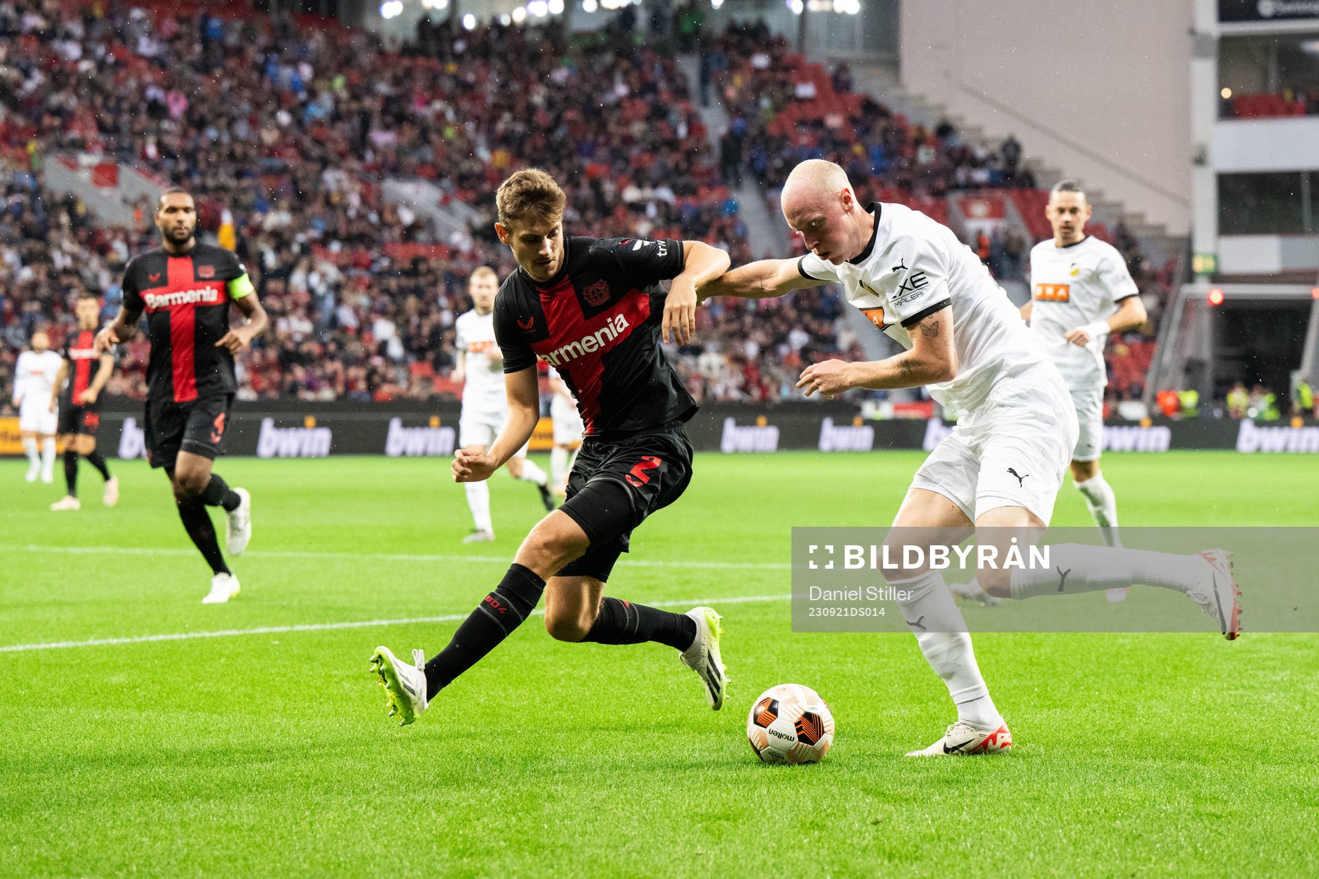 Josip Stanisic of Bayer Leverkusen and Valgeir Lunddal of Häcken during the UEFA Europa League football match between Bayer Leverkusen and Häcken on September 21, 2023 in Leverkusen.