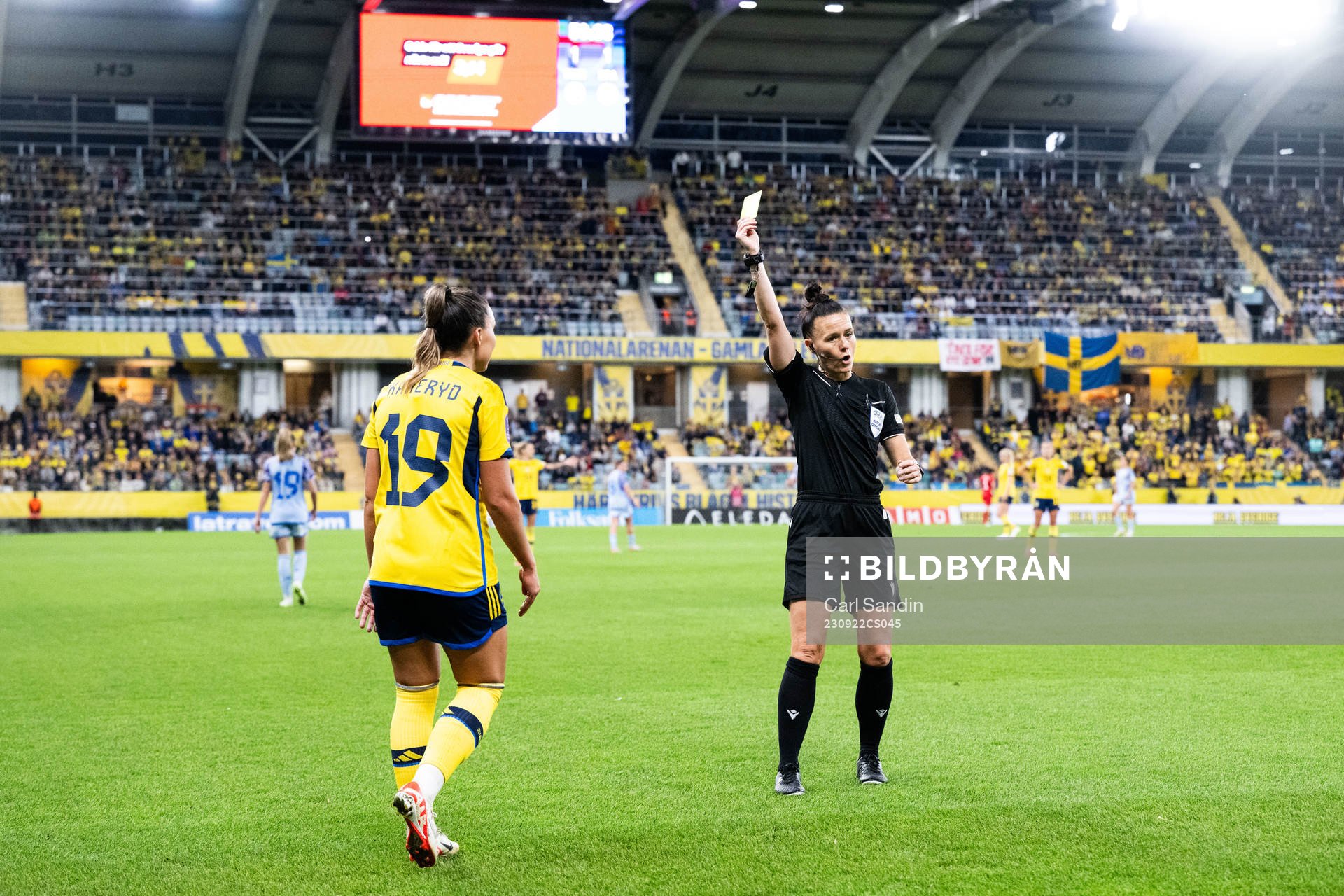 Johanna Rytting Kaneryd of Sweden receives a yellow card