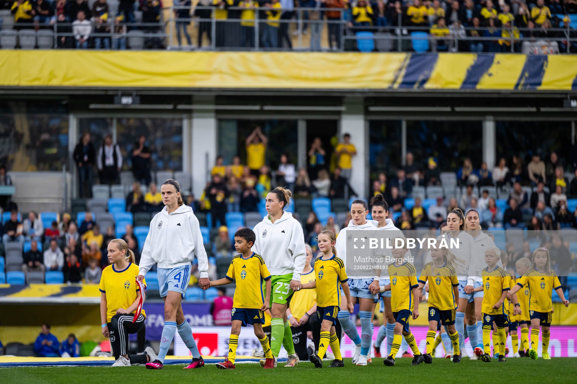 Irene Paredes and goalkeeper Cata Coll of Spain enter the