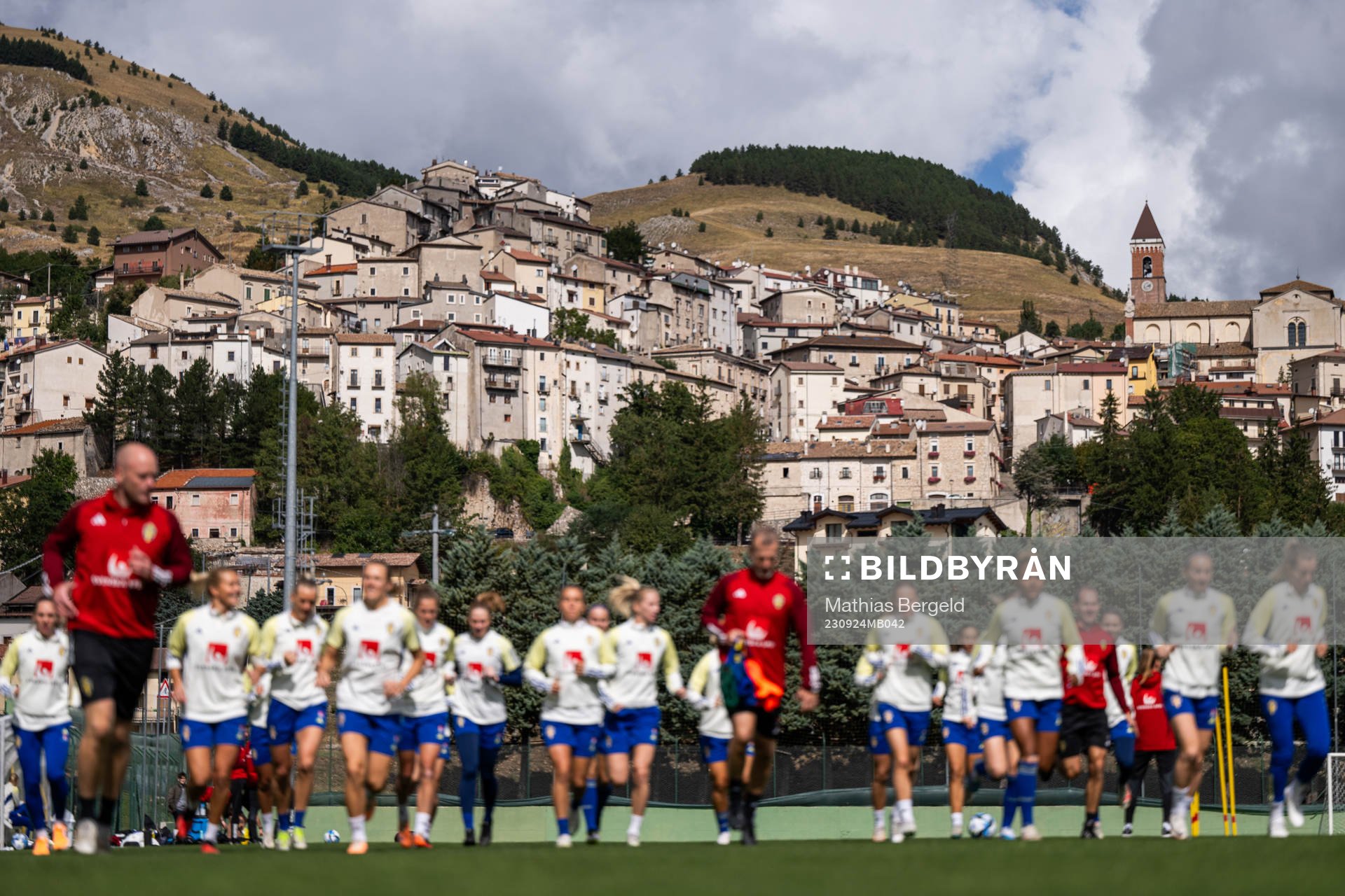 The city of Rivisondoli is seen behind players of the