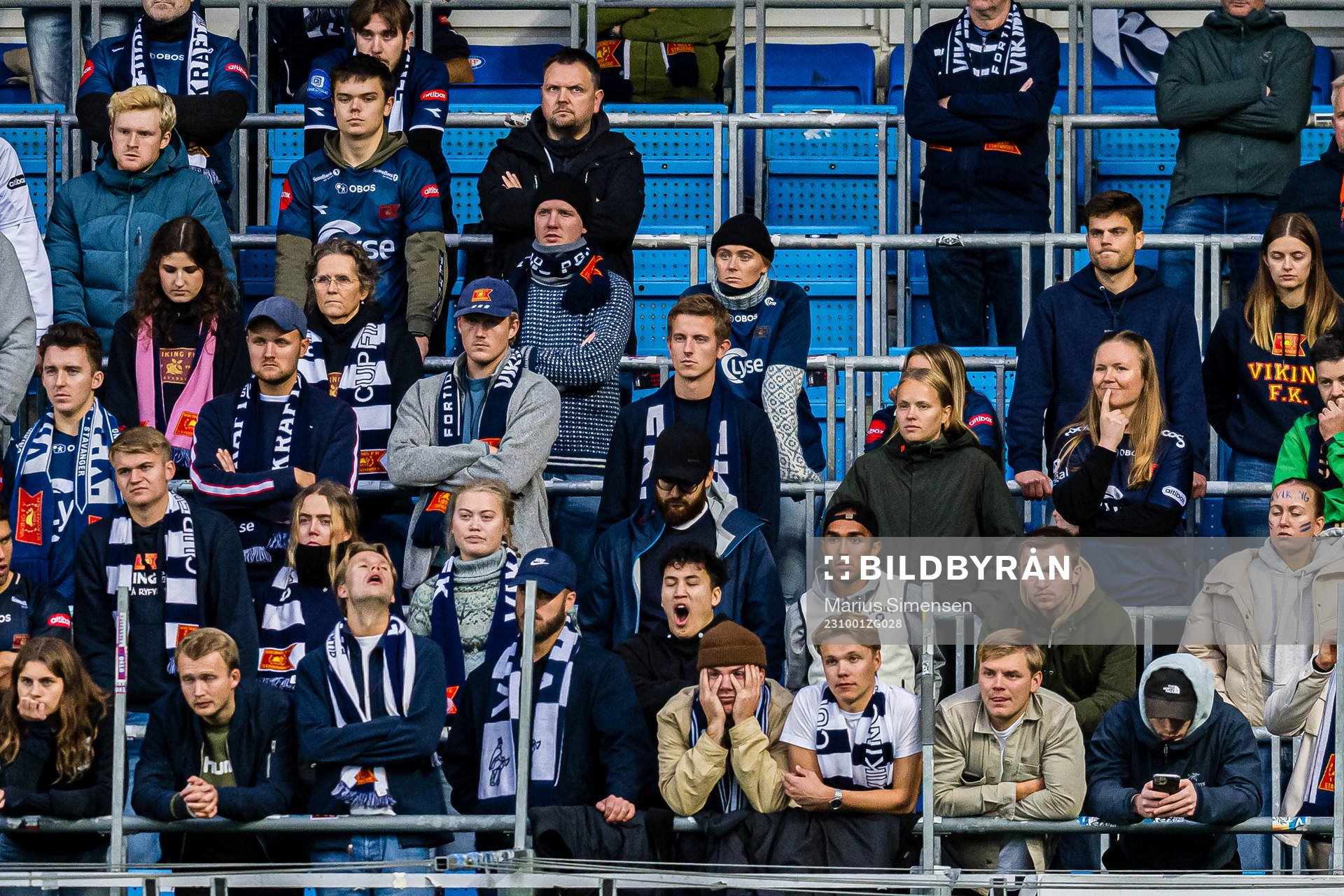 Spectators in the stands looks dejected