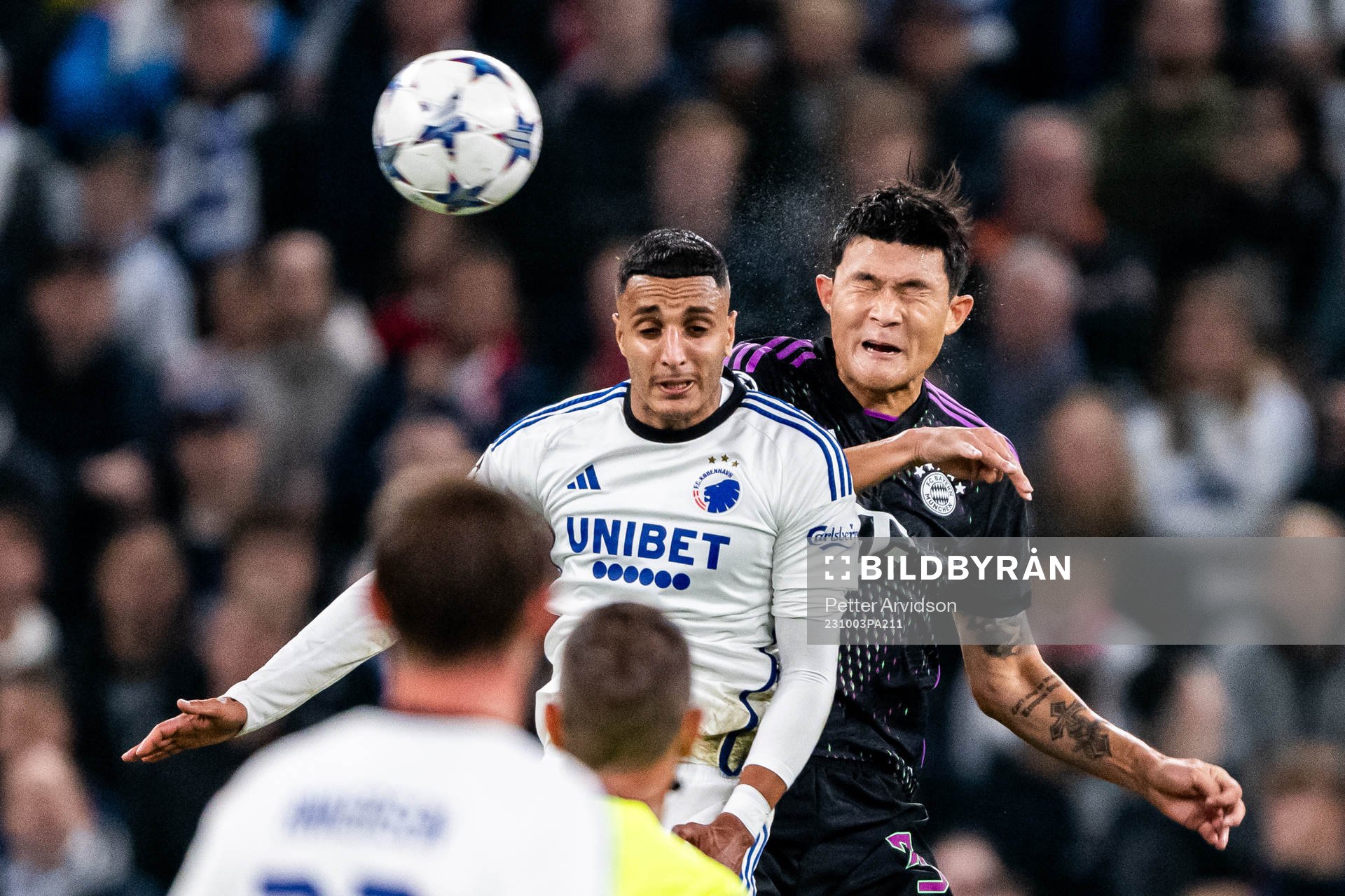 Elias Achouri of Copenhagen and Minjae Kim of Bayern Munich during the UEFA Champions League football match between FC Copenhagen and Bayern Munich on October 3, 2023 in Köpenhamn. 