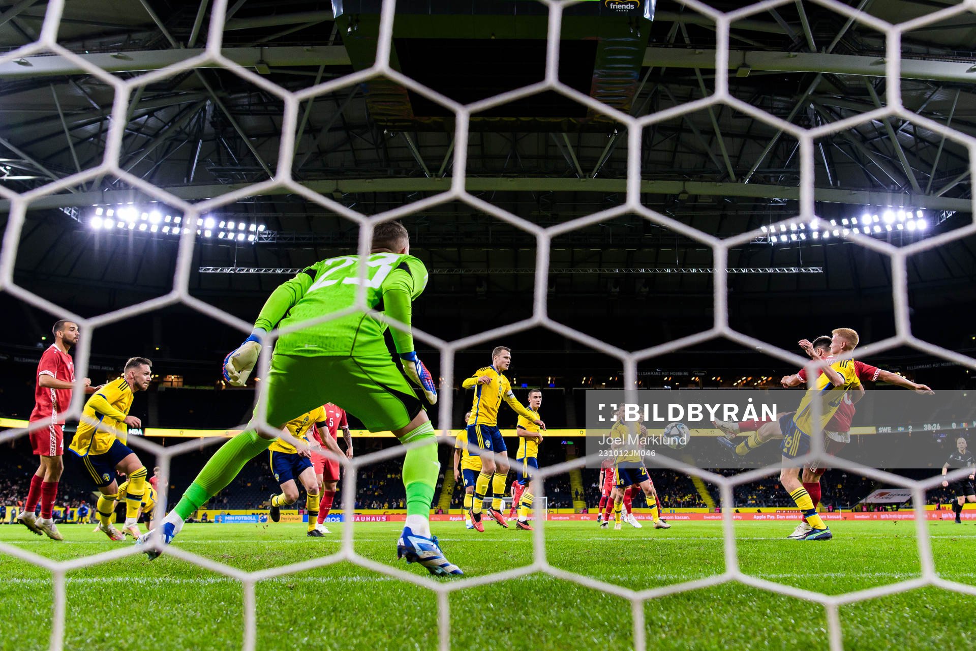 Ion Nicolaescu of Moldova scores 2-1 behind goalkeeper