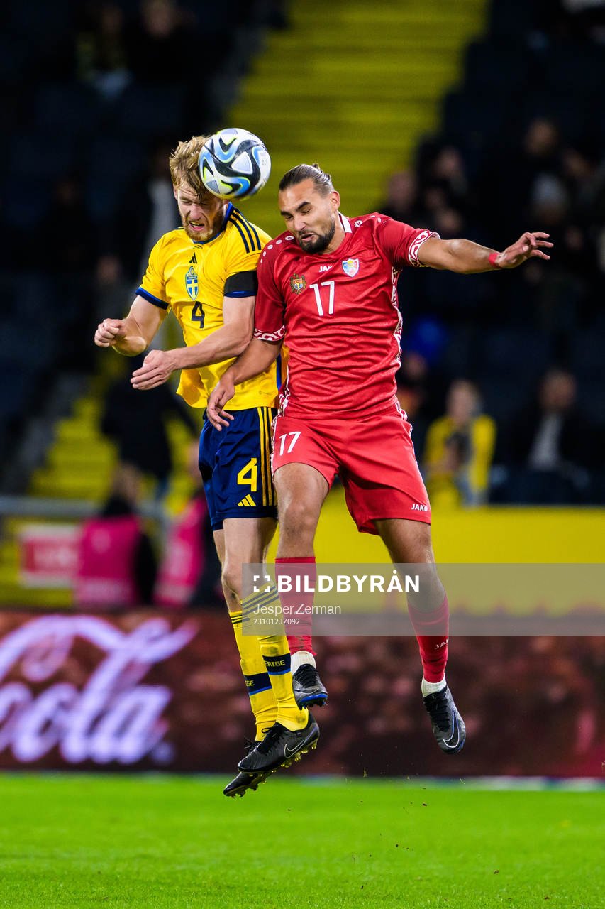Filip Helander of Sweden and Virgiliu Postolachi of Moldova during the international friendly football match between Sweden and Moldova on October 12, 2023 in Stockholm.