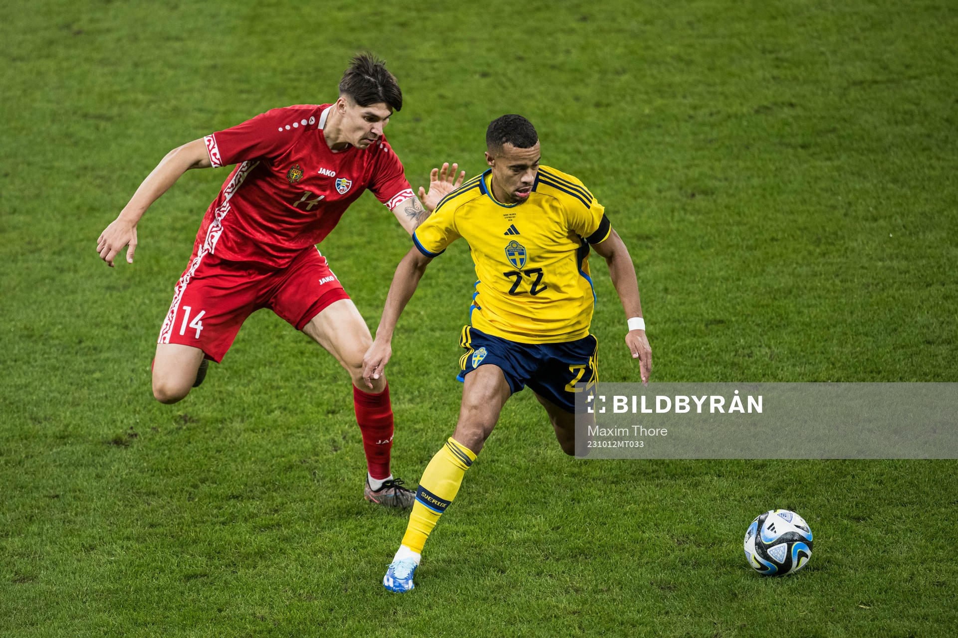 Artur Craciun of Moldova and Robin Quaison of Sweden