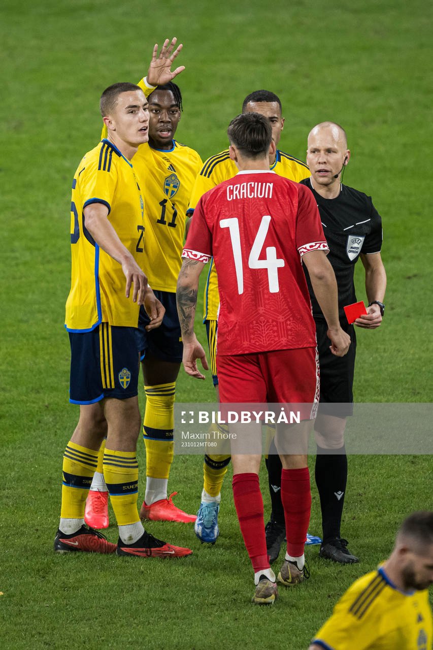 Artur Craciun of Moldova receives a red card from Referee